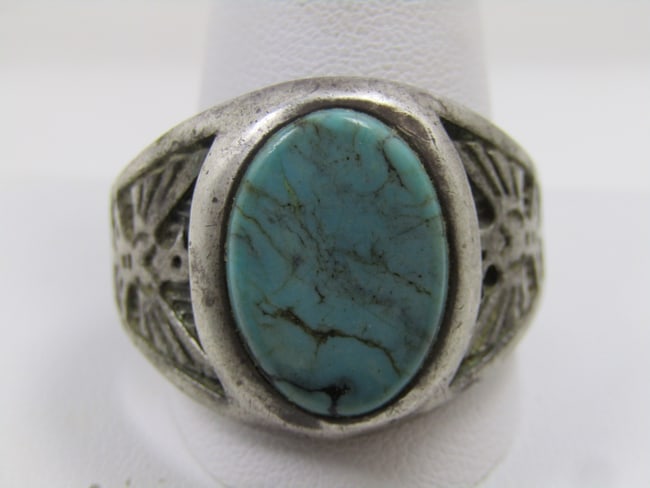 Vintage Sterling Southwestern Turquoise Thunderbird Ring, Sz. 15, 1970's-1980's, Signed WM: Vintage Sterling Southwestern Turquoise Thunderbird Ring, Sz. 15, 1970's-1980's. This has an oval turquoise cabochon that is appx. 18mm by 12.5mm set into a recessed frame. On each side of the wide sh