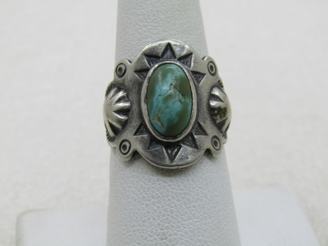 Vintage Sterling Southwestern Turquoise Ring, Open Back Adjustable, Unisex: Vintage Sterling Southwestern Turquoise Ring, Open Back Adjustable, Unisex. Age is post mid-century - 1960's-1980's. Stamped repousse ring with a center greenish oval turquoise that is bezel set and a