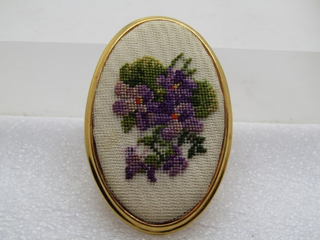 Vintage Needlepoint Violets Brooch, Made in Austria, 1960's: Vintage Needlepoint Violets Brooch, Made in Austria, 1960's. Still has its original tag made in Austria on the back. This is an oval that is appx. 2" by 1.25". Gold tone, clean and great attention to 
