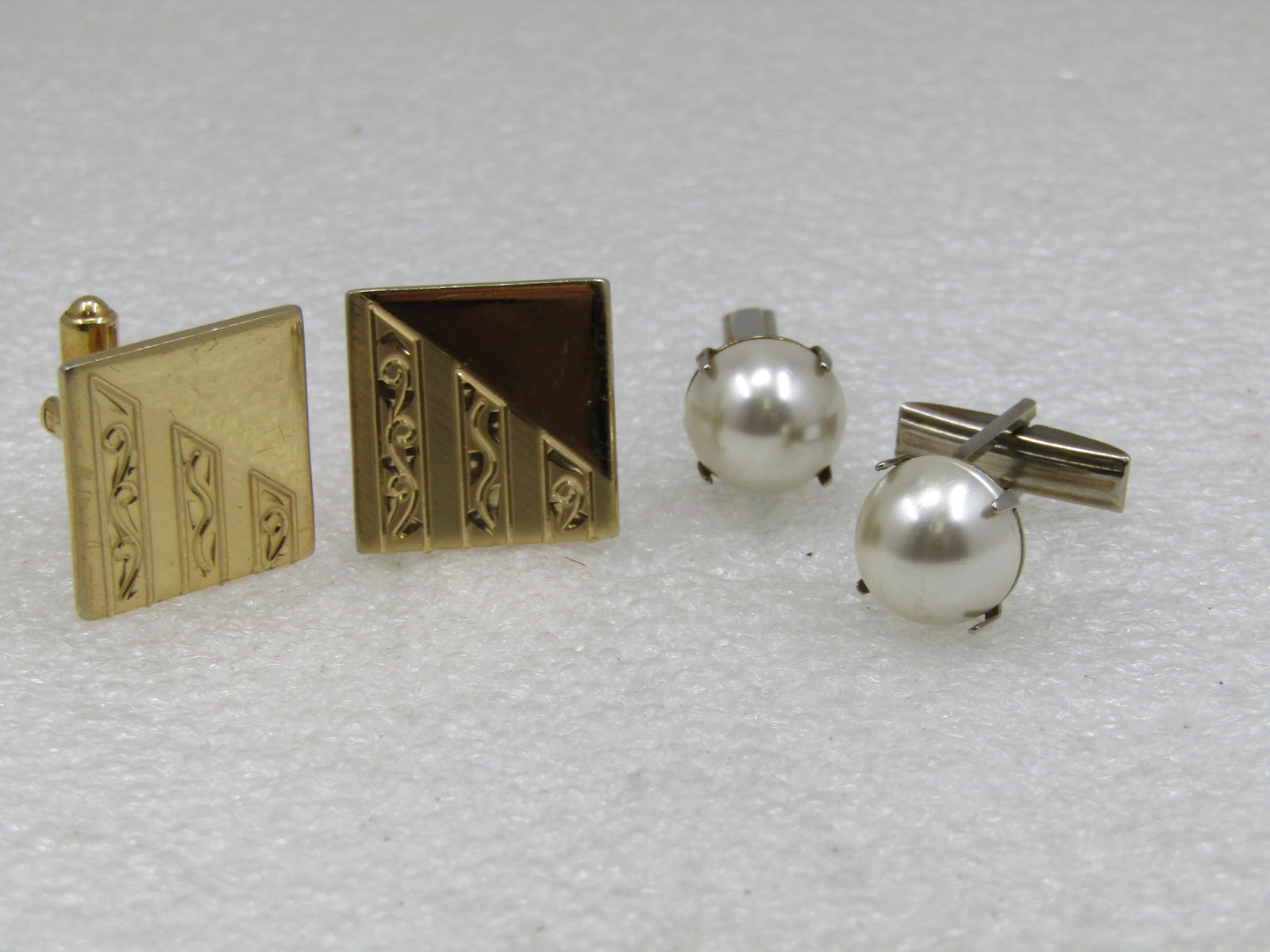 Vintage 2 Pair Cufflinks, 1950's, Faux Pearl & Square: Vintage 2 Pair Cufflinks, 1950's, Faux Pearl & Square. Silver tone 11.5mm white faux pearls prong-set. The square cufflinks have an art deco shiny and satin finish theme. They are gold tone and 3/4"