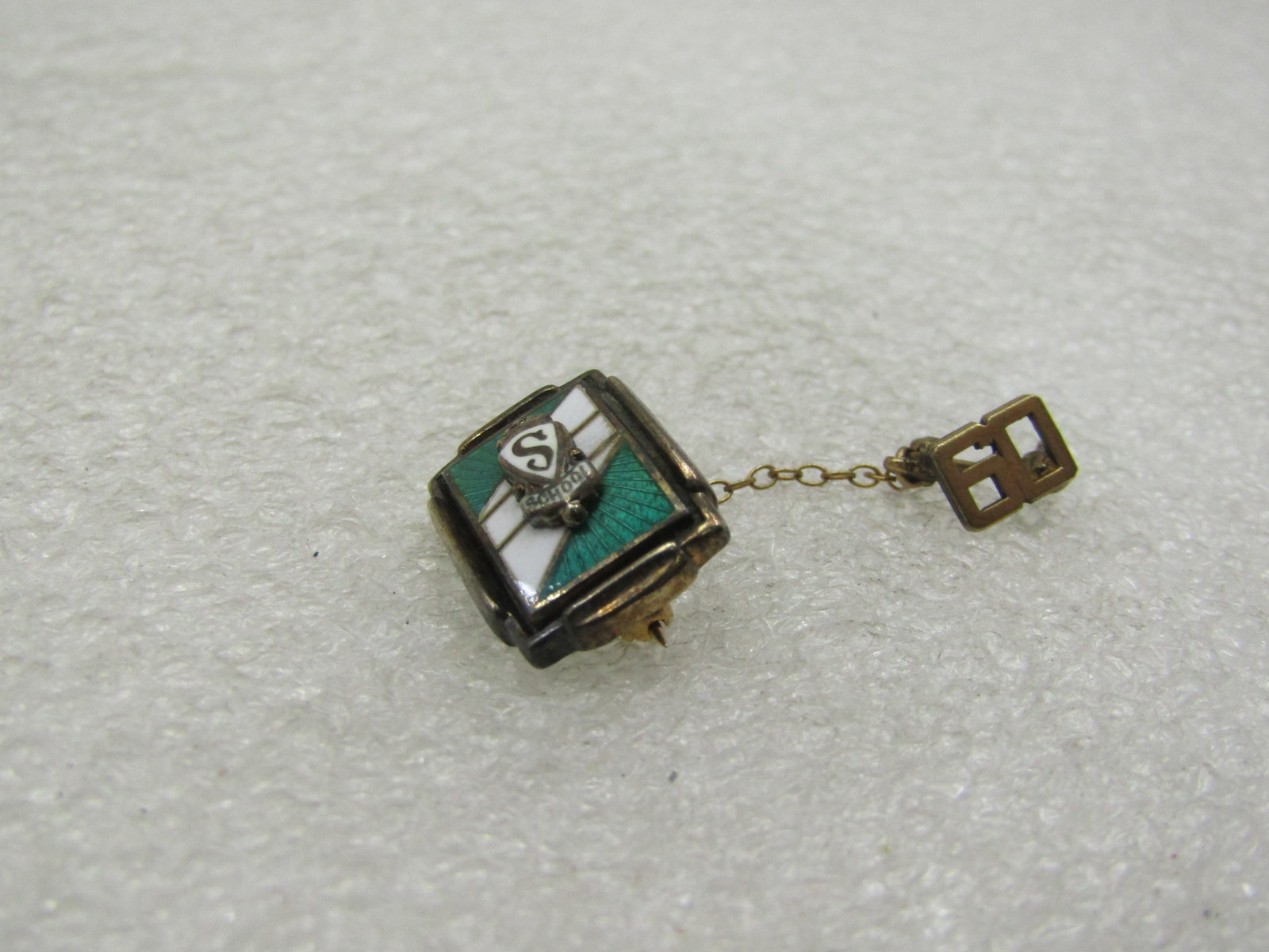 Vintage 1960's S School Pin with Year, Enameled Green & White: Vintage 1960's S School Pin with Year, Enameled Green & White. This has a rectangular 3/4" by 1/2" white and green enameled center with a raised S in white and the word School under that. Attached to