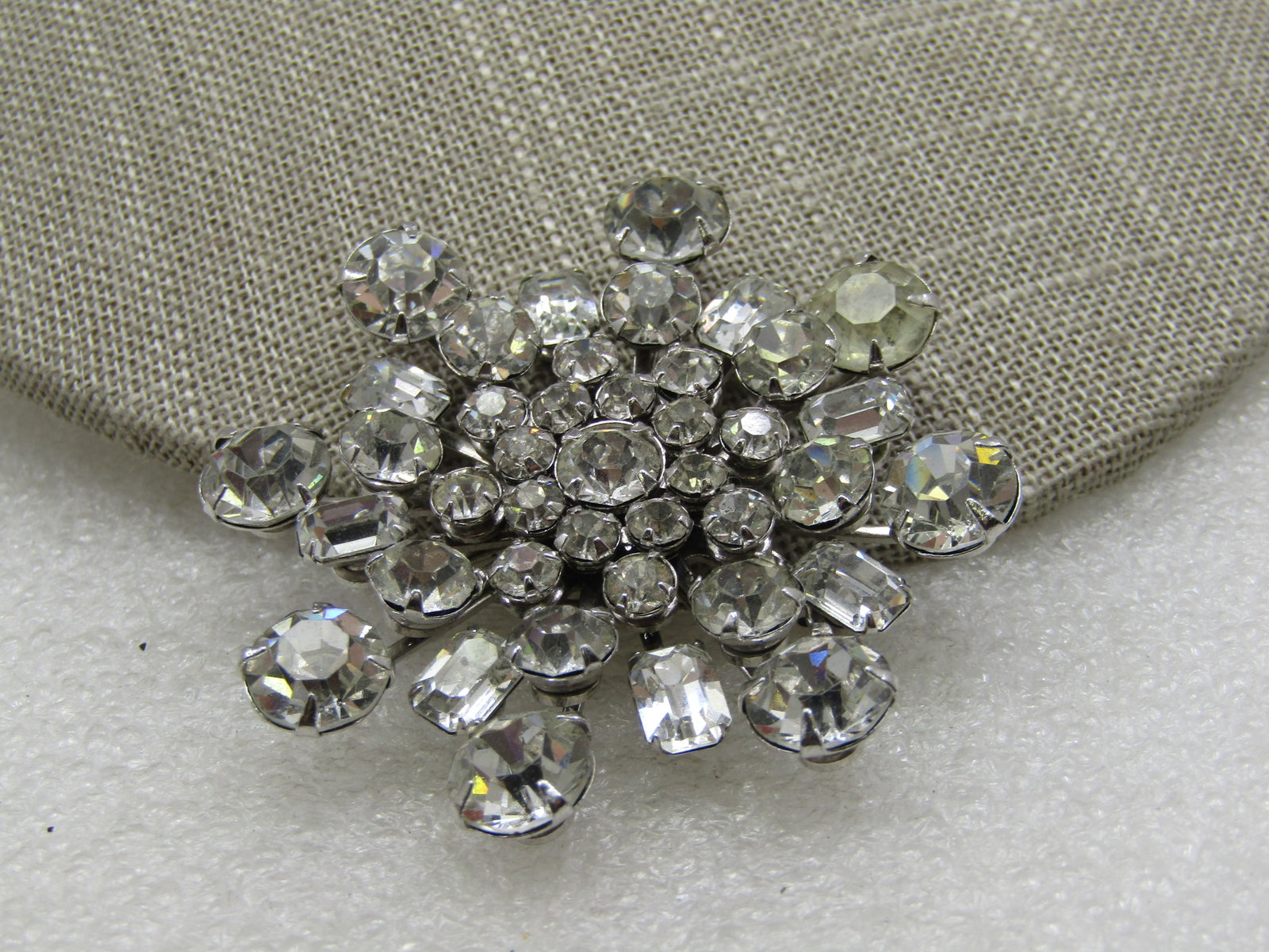 Vintage Clear Rhinestone Tiered Blossom Brooch, 2", 1940's-1960's: Vintage Clear Rhinestone Tiered Blossom Brooch, 2", 1940's-1960's, Silver tone with graduated 4mm to 8.5mm round rhinestones and princess cut rectangular stones that are appx. 6.5mm by 5. Not signed