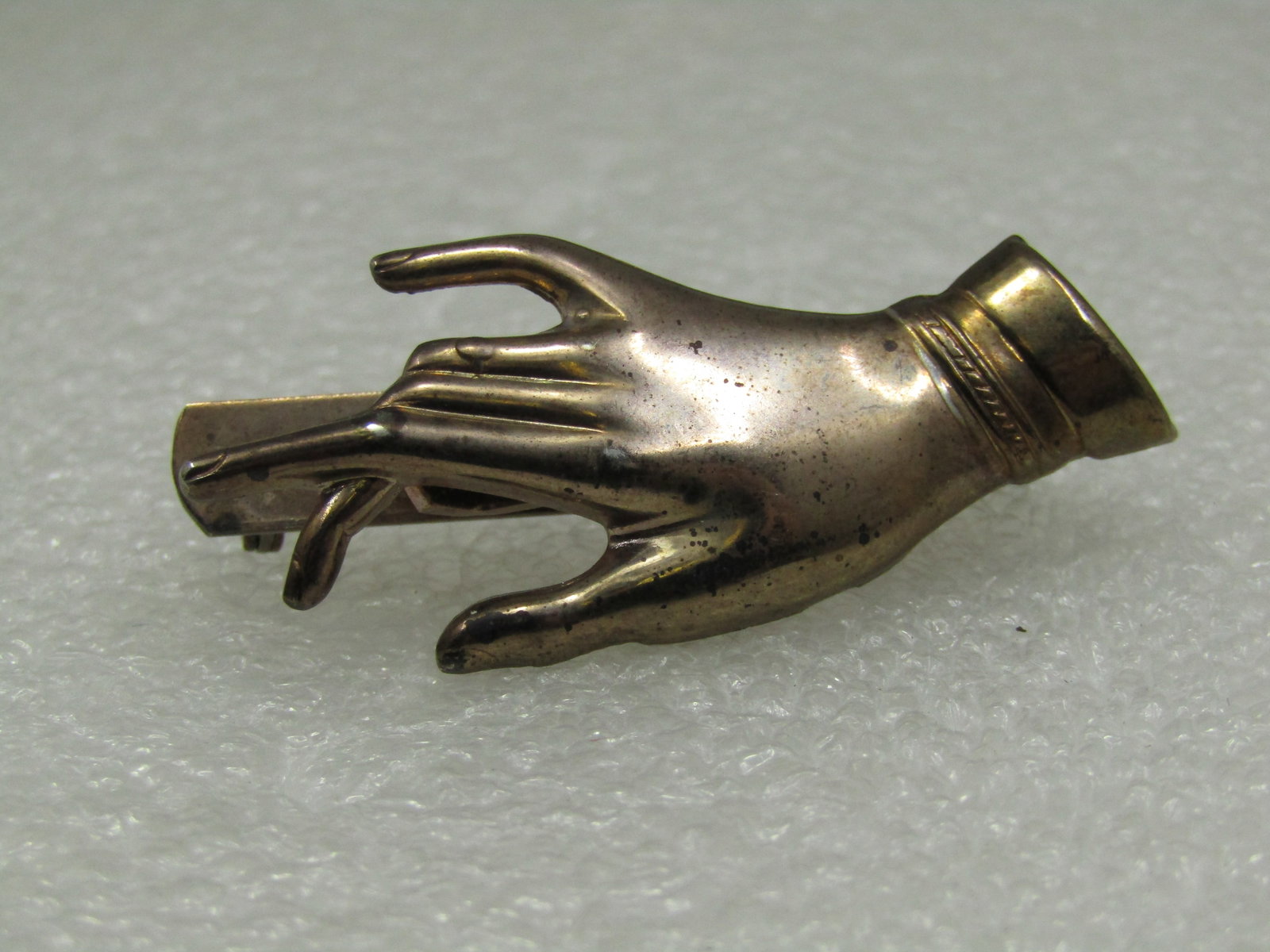 Vintage Hand Brooch With Open Area to Hold Something, 1940's-1950's: Vintage Hand Brooch With Open Area to Hold Something, 1940's-1950's, Gold Tone hand with a 1/4" U slot to dangle something from your brooch. It's functional brooch but can be worn as is too. 1.75"