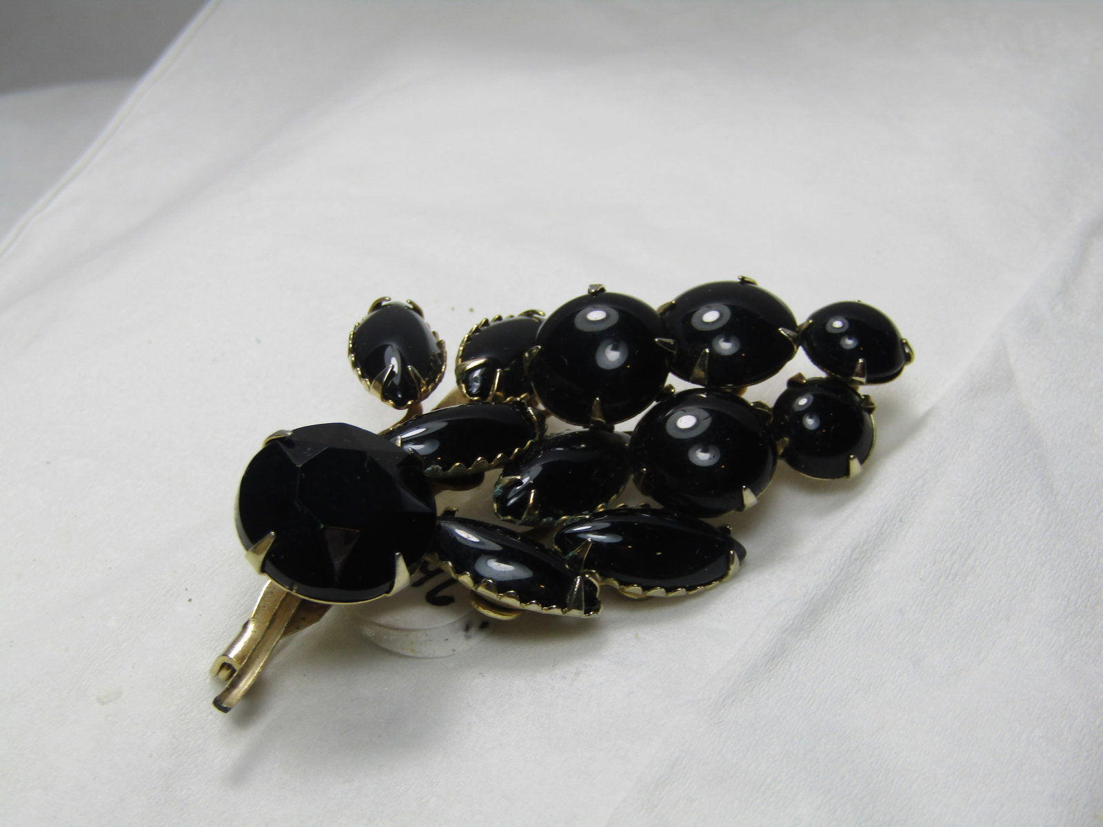 Vintage Black Glass Navette & Round Art Deco Brooch, 1960's, 2.5": Vintage Black Glass Navette & Round Art Deco Brooch, 1960's, 2.5" tall and 1.5" wide. Prong and bezel set. Round stones range from 8mm to 3mm, some cabochons with smooth domed surface and one is