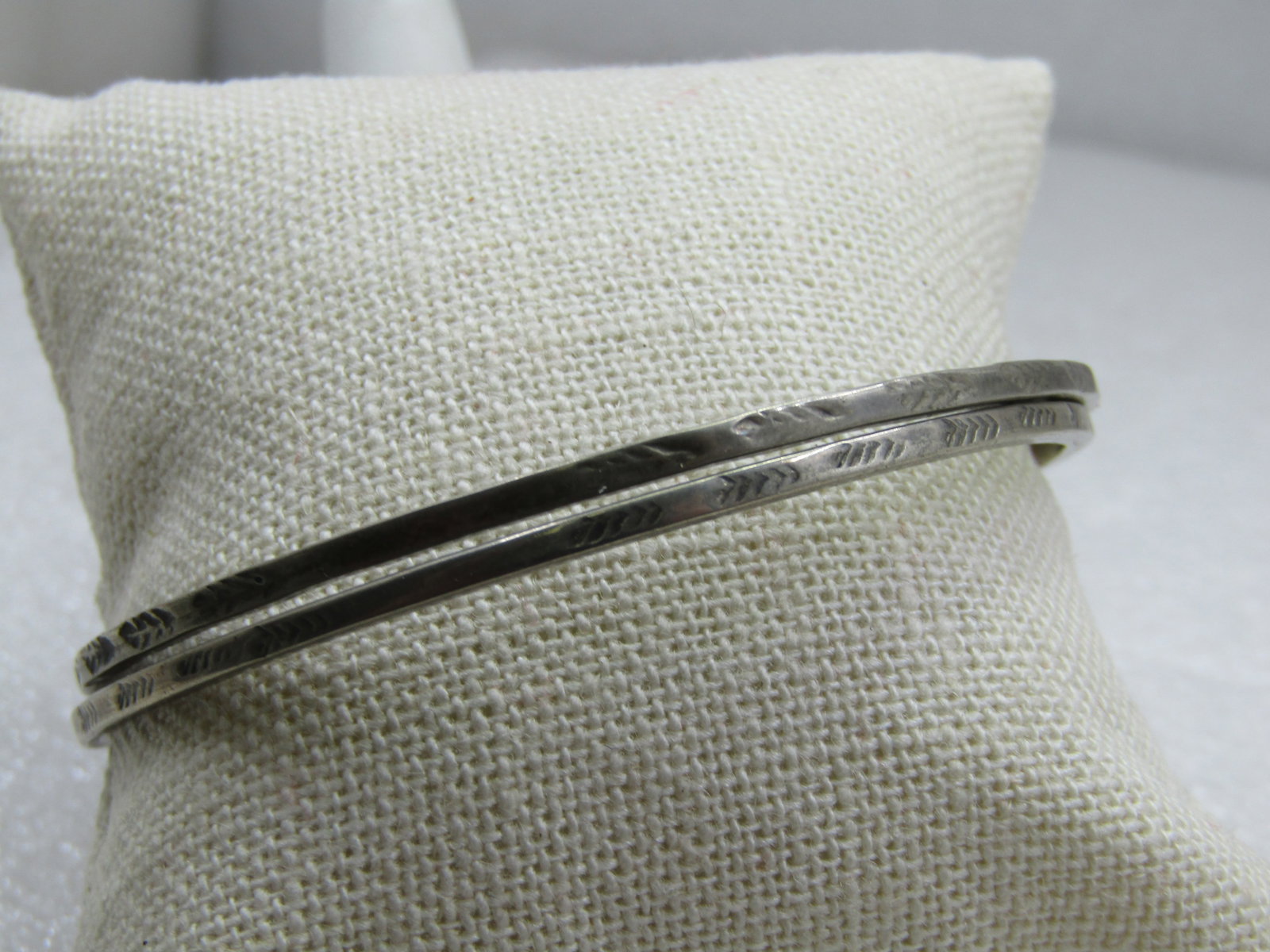 Vintage Pair Sterling Bangle Bracelets, Taxco, Mexico, 7.75": Vintage Pair Sterling Bangle Bracelets, Taxco, Mexico, 7.75", stamped design on both. 2.4mm wide and 2.5" opening. Age isiappx. 1960's. Marked Taxco, Mexico, .925, tested, weight is apx. 14.38 gr. Ver