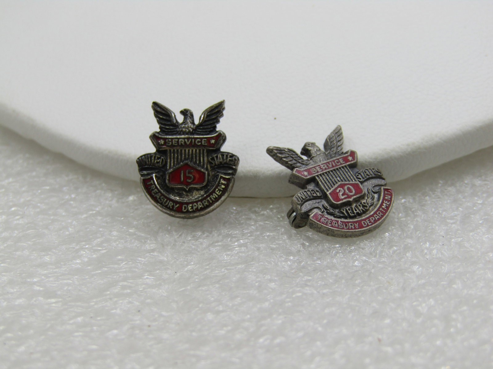 Vintage Pair Sterling 15 Yr 20Yr Treasury Department Service Brooches: Vintage Sterilng 15 Yr 20Yr Treasury Department Service Brooches. Two brooches/pins. Signed Wallace Sterling 3.54 grams with red enameling under sterling letters that have Service then the year 15 on