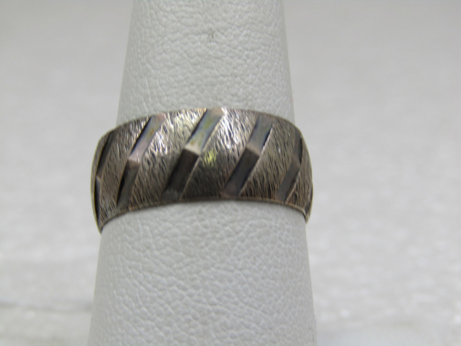 Vintage Sterling 7.5mm Wide Band Ring, Sz. 8, Signed M.H: Vintage Sterling 7.5mm Wide Band Ring, Sz. 8, Signed M.H. Unisex ring, domed, marked sterling, weight is appx. 3.60 gr. Textured diagonal accents. Age is mid-century. Very good condition other than