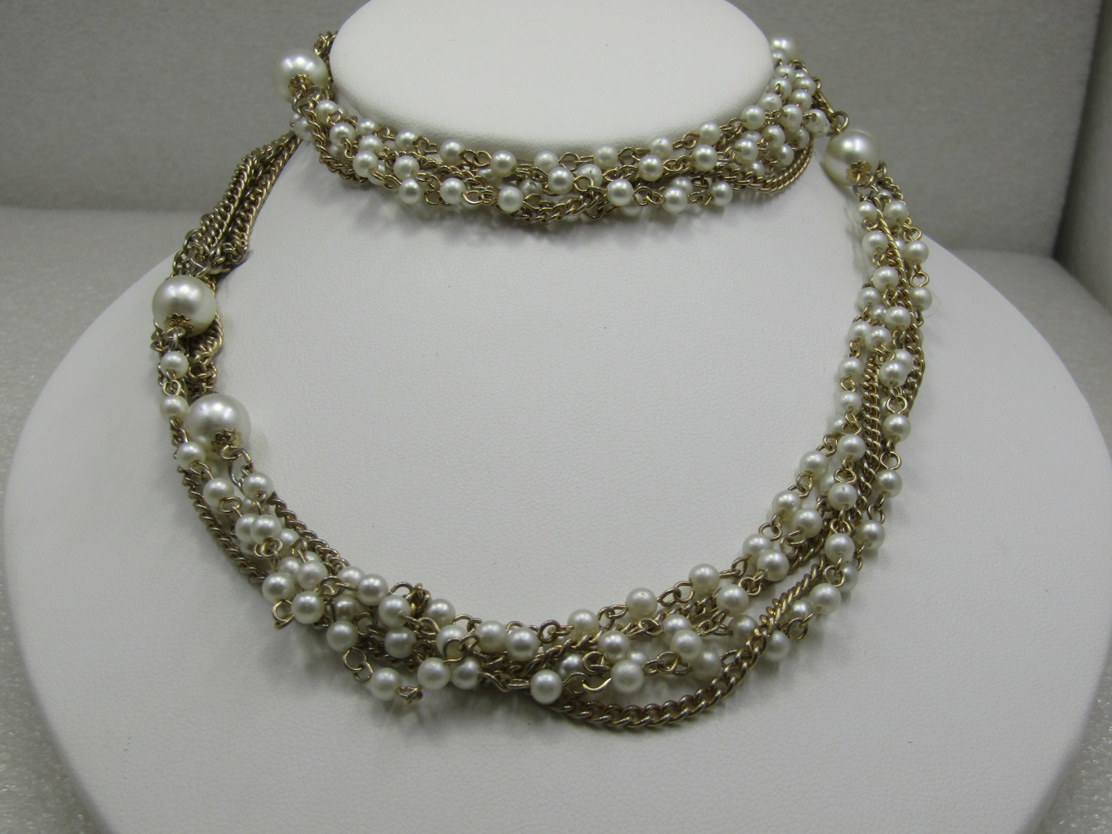 Vintage Faux Pearl Multi-Strand 56" Necklace 1960's: Vintage Faux Pearl Multi-Strand 56" Necklace 1960's. This has sections of mixed five-strand gold tone chain lengths, different style links mixed with sections of three strands with faux pearls and a