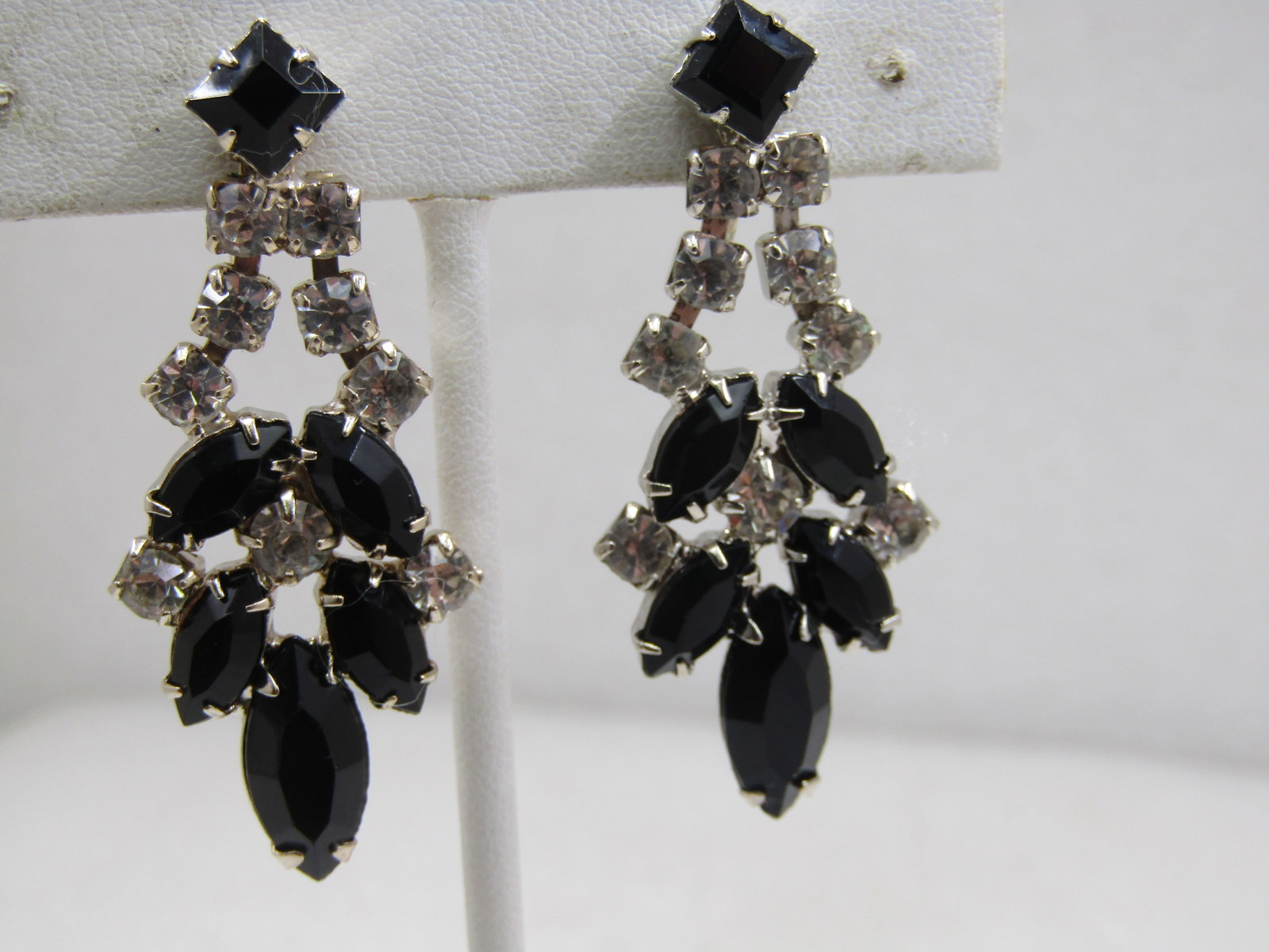 Vintage Black/Clear Rhinestone Screwback Earring, Art Deco Themed: Vintage Black/Clear Rhinestone Screwback Earring, Art Deco Themed, 2" by 3/4" Marquise and square black stones and clear white round stones. .Silver tone, not signed by the maker. Very good
