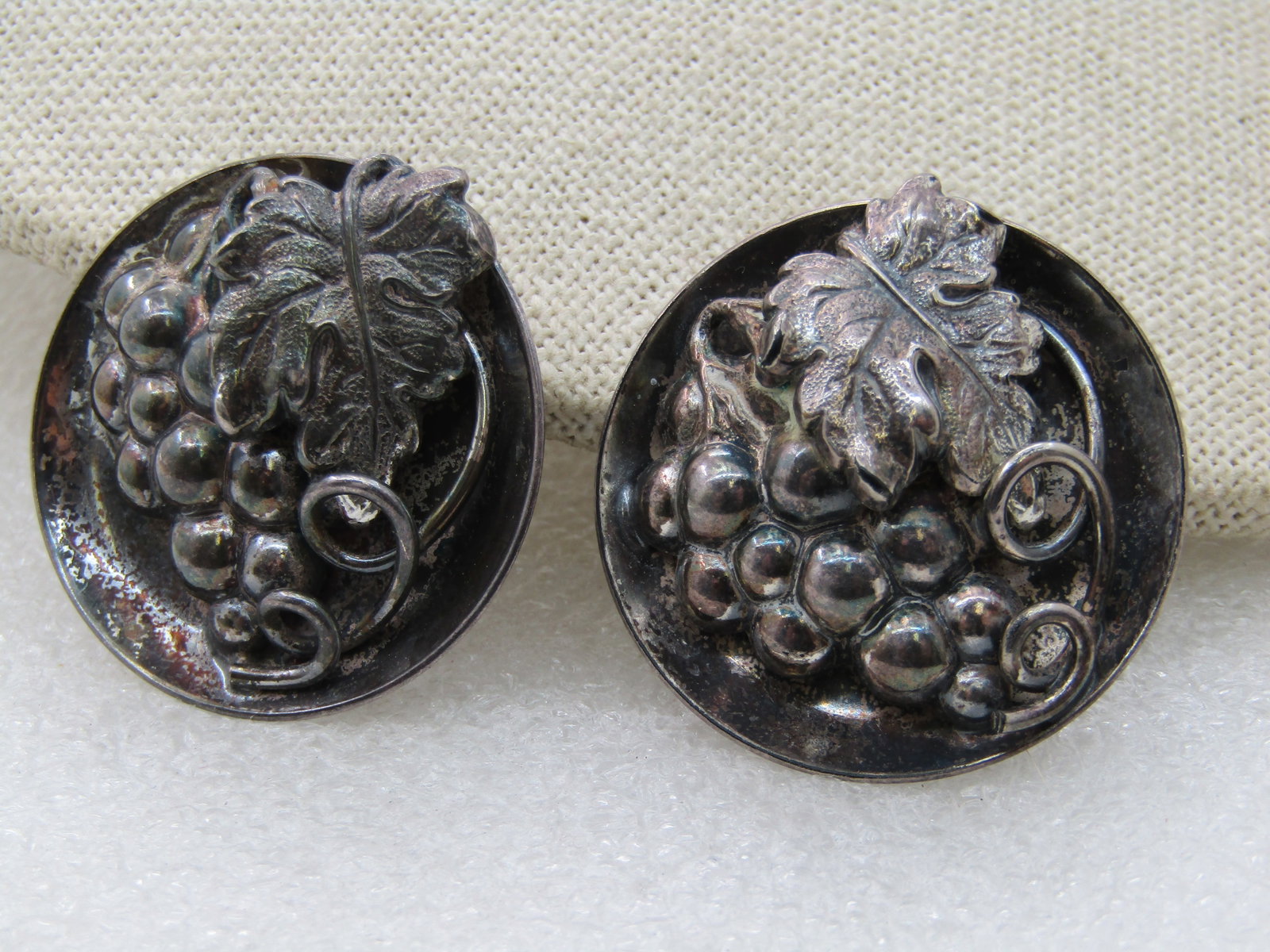 Vintage Sterling Napier Grape Cluster Earrings, Clip. 1.25": Vintage Sterling Napier Grape Cluster Earrings, Clip. 1.25" Round bowl like design with a cluster of grapes, large leaf and curled fine. Signed Napier and Pat. Pending. Tested and test as sterling.
