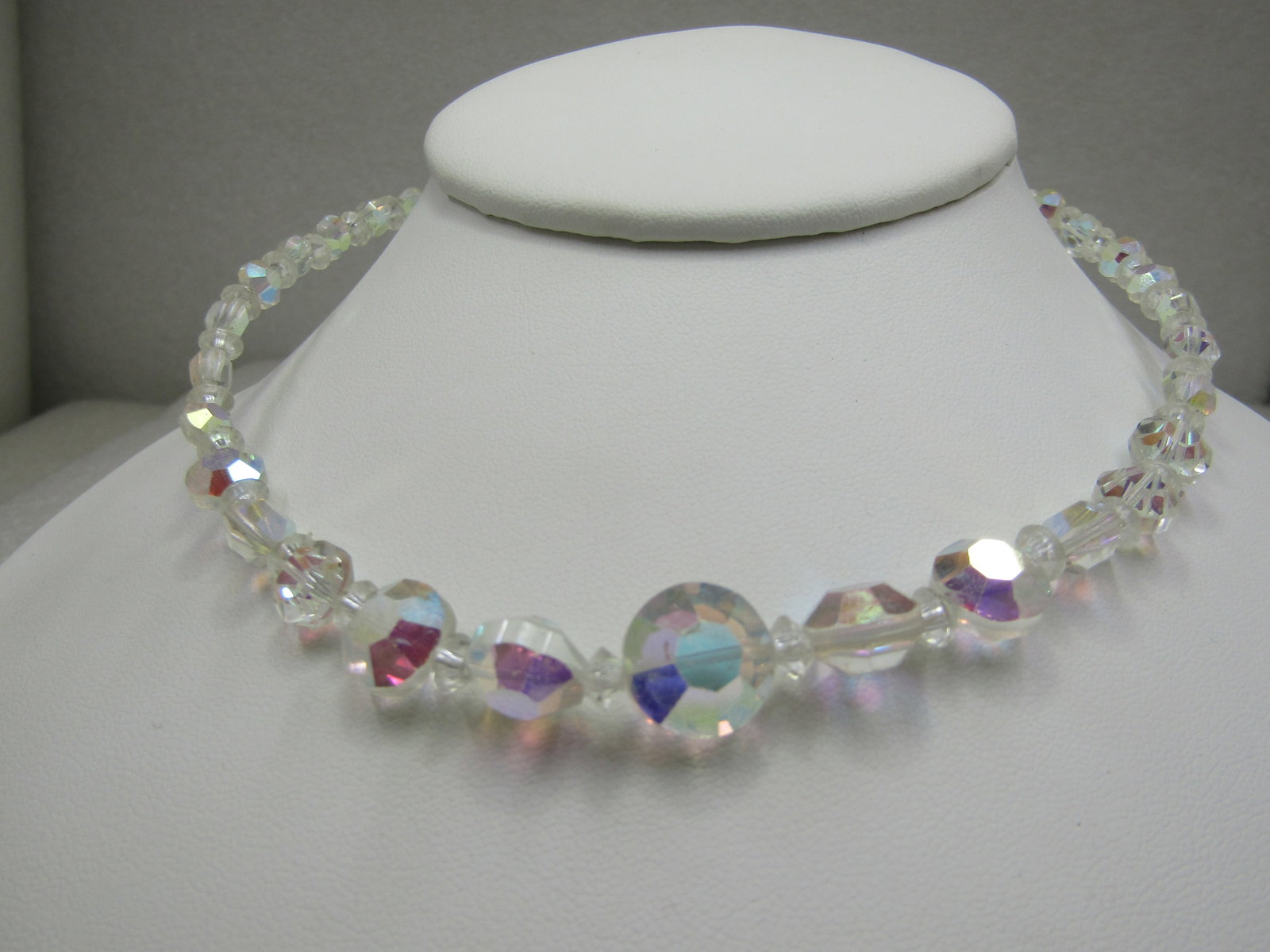 Vintage Aurora Borealis Crystal Choker, 15.5": Vintage Aurora Borealis Crystal Choker, 15.5", hook clasp - slender neck works best - the main part of the necklace is 12" with an additional 3.5 as a beaded extender chain. The beads have flat cut ti