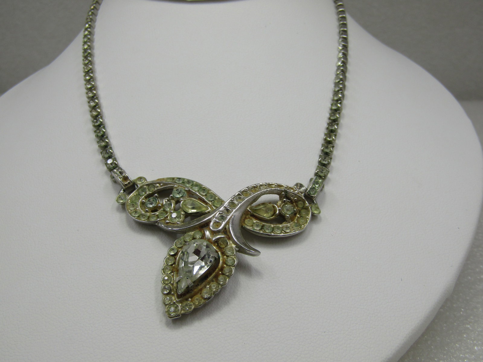 Vintage Art Deco Rhinestone Necklace, 15.5", 1940's: Vintage Art Deco Rhinestone Necklace, 15.5", 1940's. Silver tone rhinestone linked necklace with a rhinestone center drop with pear and round stones. The drop is looped with a teardrop rhinestone halo