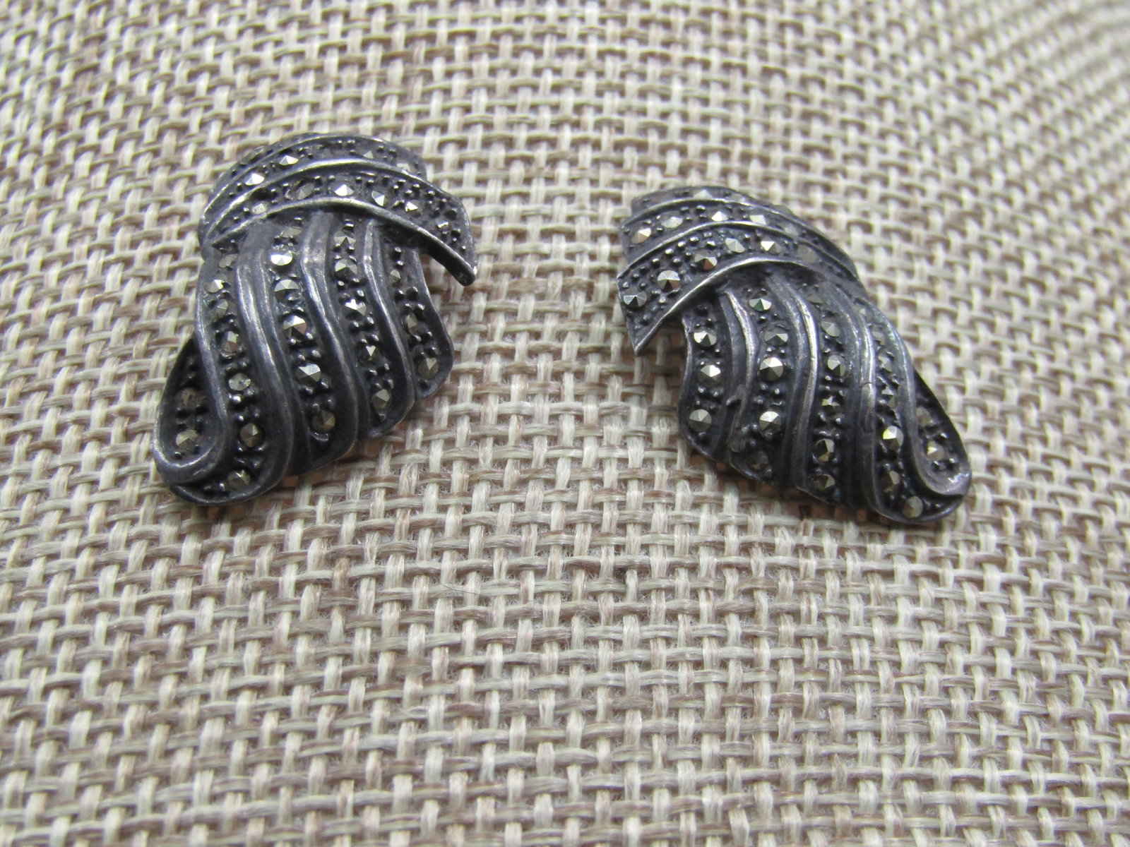 Vintage Sterling Marcasite Earrings, 1940's-1950's: Vintage Sterling Marcasite Earrings, 1940's-1950's, possibly earier. Criss-cross curved art deco design. Marked .925 and tested. 1" by appx. 3/4", tapered. Weight is appx. 7.67 gr. The clutches are