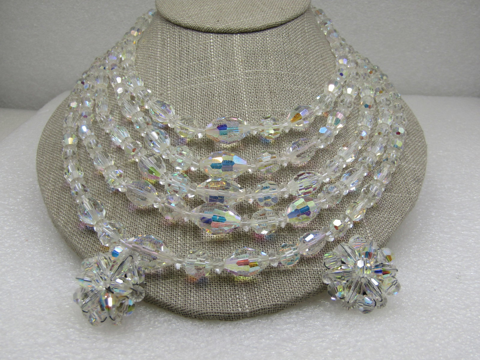Vintage Five Strand Aurora Borealis Crystal Necklace & Earrings, Clip: Vintage Five Strand Aurora Borealis Crystal Necklace & Earrings, Clip. The necklace is 17" from end to end, hook clasp. 1" earrings. Crystal faceted beads that are appx. 6.5mm to 11.5mm. Very clean