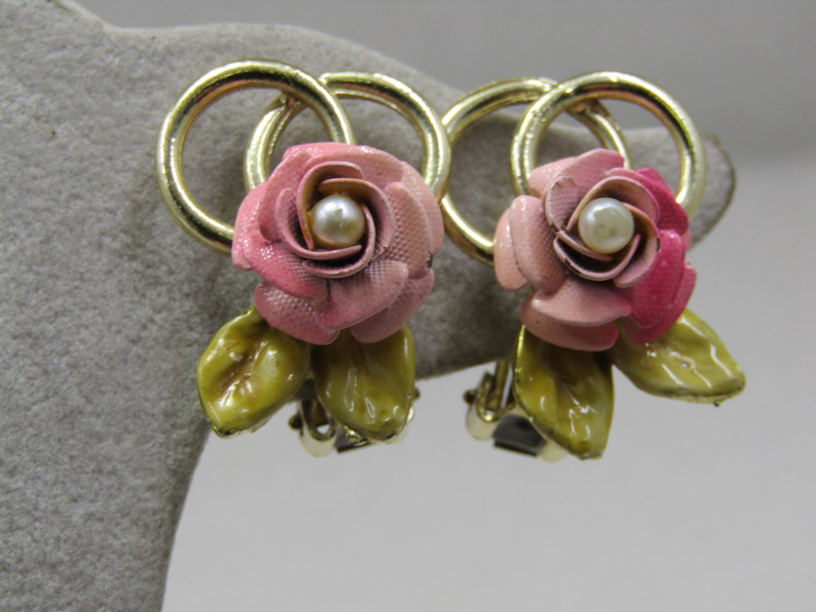 Vintage Enameled Rose Clip Earrings, Faux Pearl, 1940's-1950's: Vintage Enameled Rose Clip Earrings, Faux Pearl, 1940's-1950's. They are 1" long and 3/4" wide with two circle accents, a shaded pink rose blossom with center faux pearl and light green enameled leave