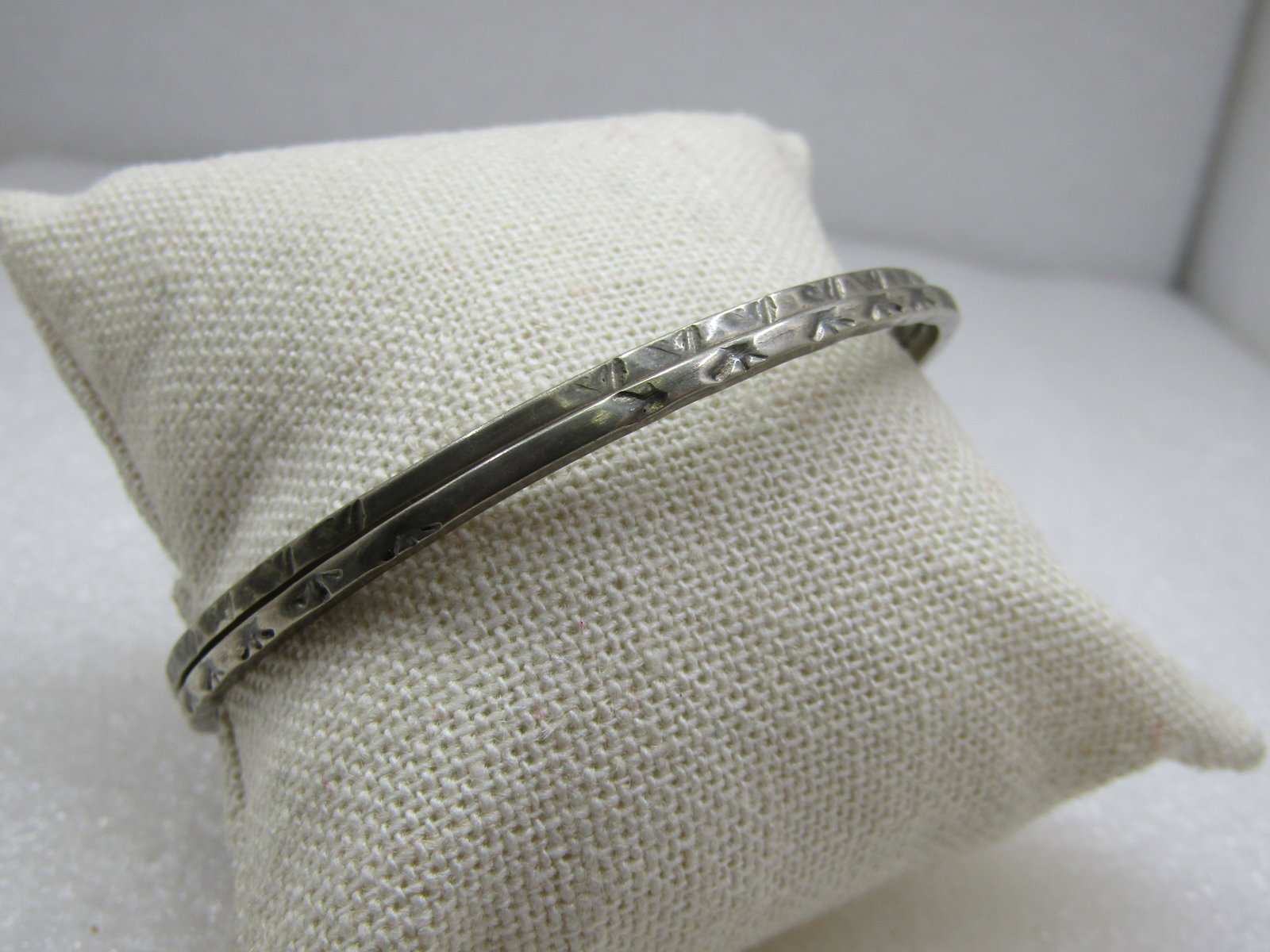 Vintage Pair Sterling Bangle Bracelets, Taxco, Mexico, 7.75": Vintage Pair Sterling Bangle Bracelets, Taxco, Mexico, 7.75", stamped design on both. 2.4mm wide and 2.5" opening. Age is appx. 1960's. Marked Taxco, Mexico, .925, tested, weight is apx. 14.38 gr.