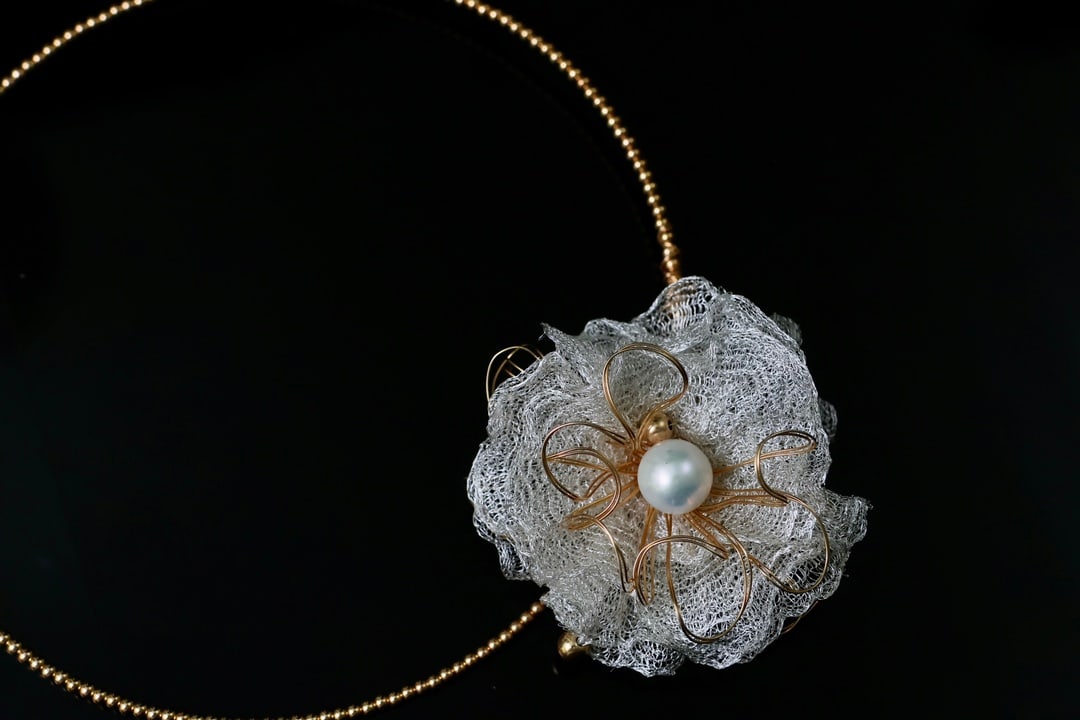 Natural Freshwater Pearl necklace: Title: Natural Freshwater Pearl necklace Description: This choker features material with natural freshwater pearls, showcasing a rich golden hue and cool white luster. Each pearl is meticulously