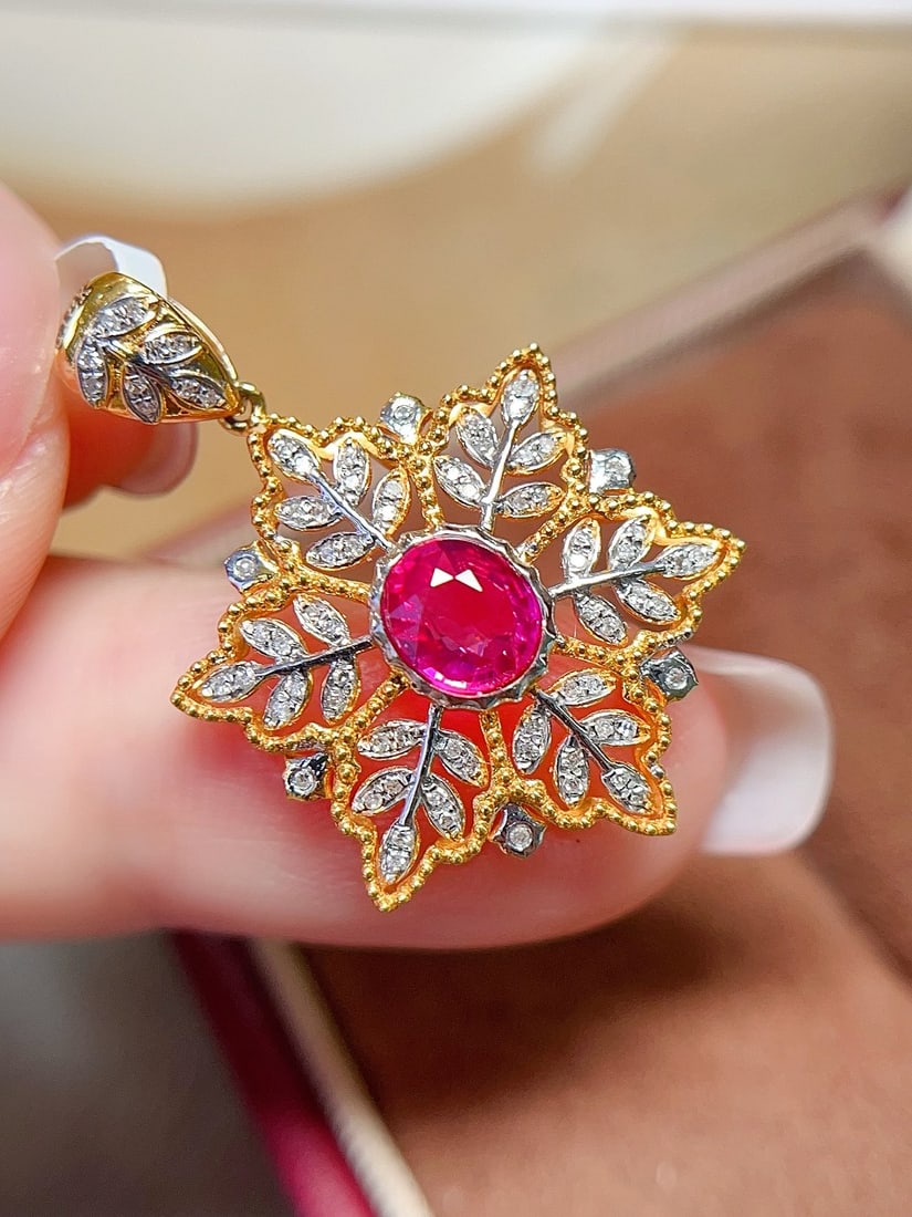 18K Gold Ruby Pendant: Title: 18K Gold Ruby Pendant Description: This 18K gold ruby pendant is renowned for its untreated pigeon blood red hue and glass-like transparency. The maple leaf design adds a poetic touch, perfectl