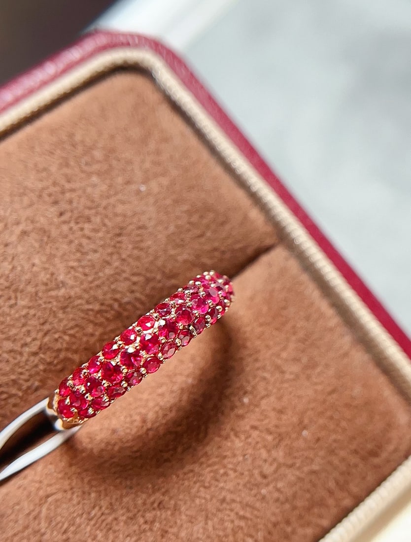 18K Gold Ruby Ring: Title: 18K Gold Ruby Ring Description: This ring is crafted in 18K gold, featuring a natural ruby with a rich pigeon blood hue. The perfectly round cut gemstone shines brilliantly in the starry