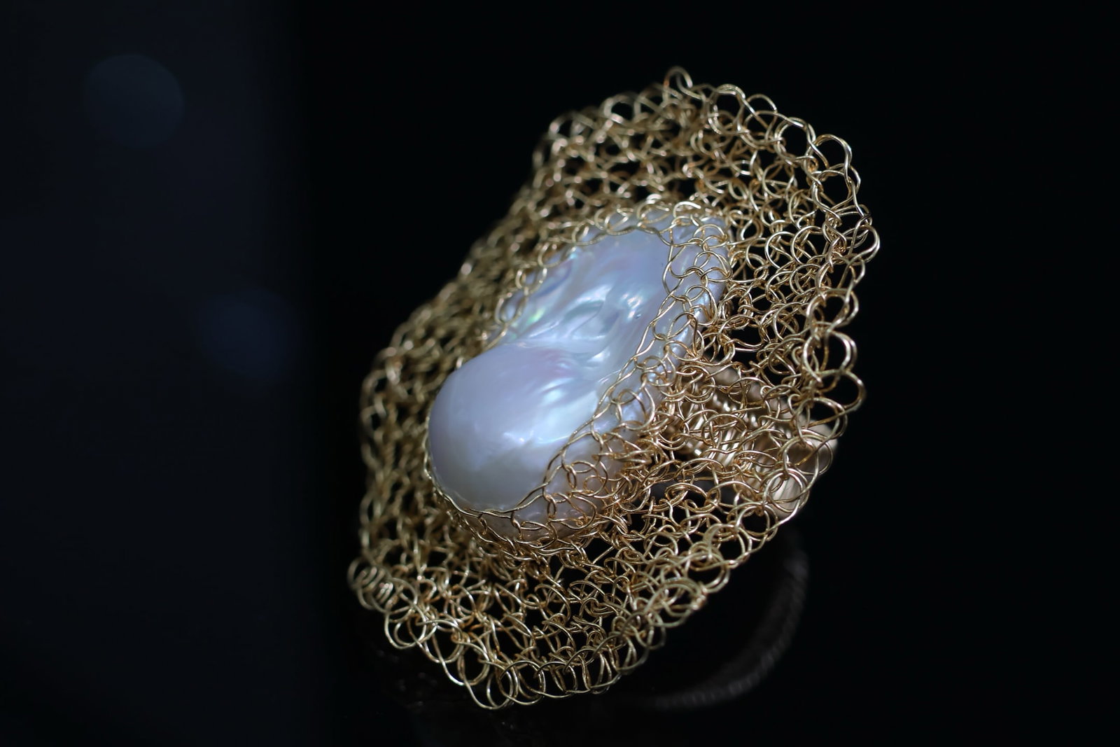 Natural Baroque Pearl Ring: Title: Natural Baroque Pearl Ring Description: This ring features a natural baroque pearl. The pearl displays a rich golden hue and a cool white luster. Its full luster and large diameter, combined
