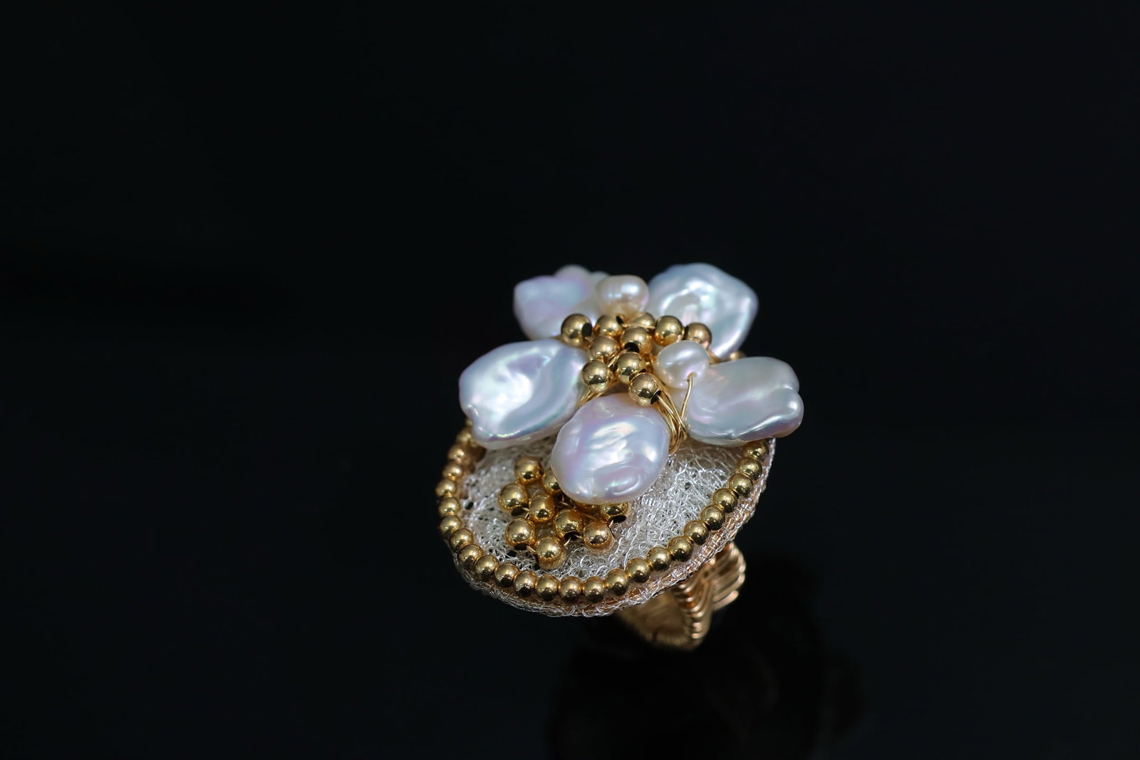 Natural Freshwater Pearl Ring: Title: Natural Freshwater Pearl Ring Description: This ring combines Italian lace craftsmanship with natural freshwater pearls. It perfectly blends rich gold and cool white. Each pearl is carefully se