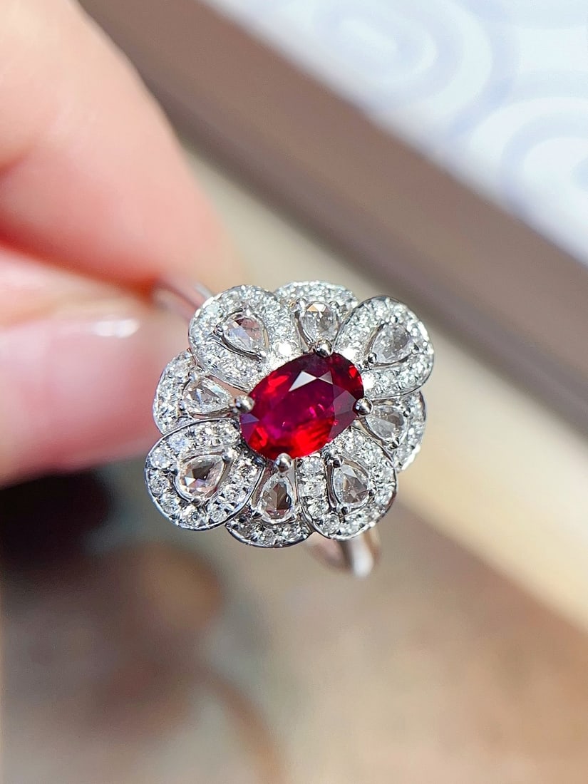 18K Gold Ruby Ring: Title: 18K Gold Ruby Ring Description: 18K Gold Ruby Ring Featuring a main stone of approximately 0.5 carats, complemented by 65 diamonds, and a total weight of 3.38 grams, it perfectly embodies the e