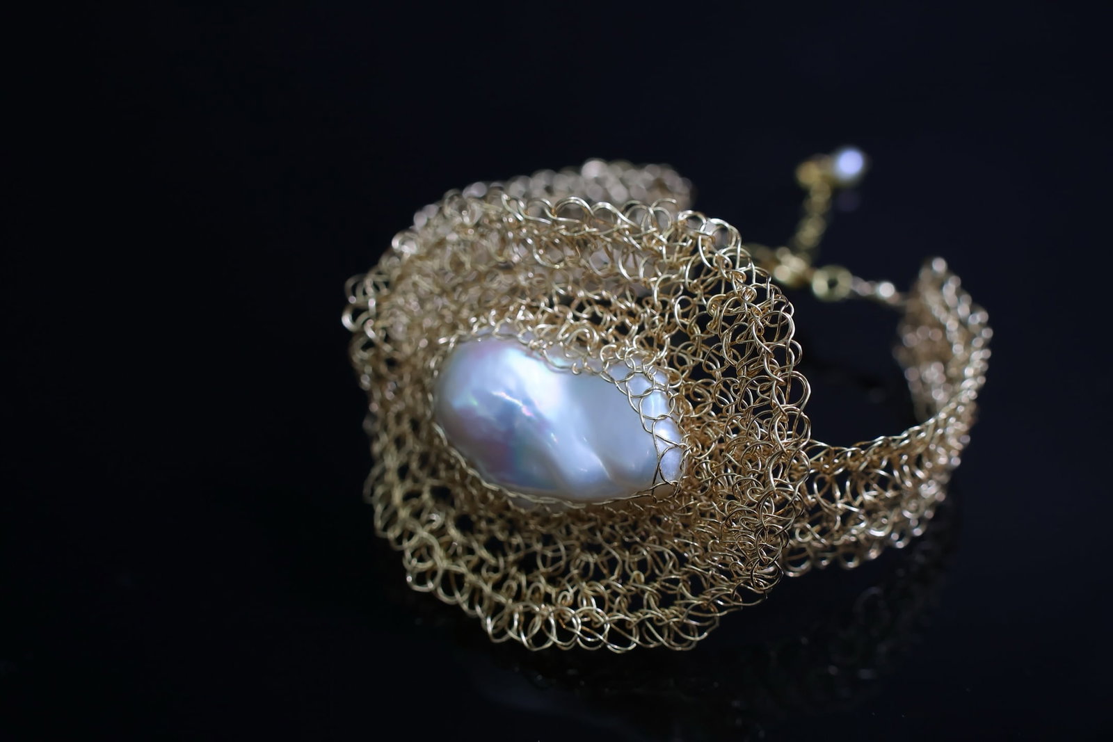 Natural Baroque Pearl Bracelet: Title: Natural Baroque Pearl Bracelet Description: This bracelet features material paired with natural iridescent Baroque pearls, showcasing a perfect blend of rich gold and cool white. The pearls'