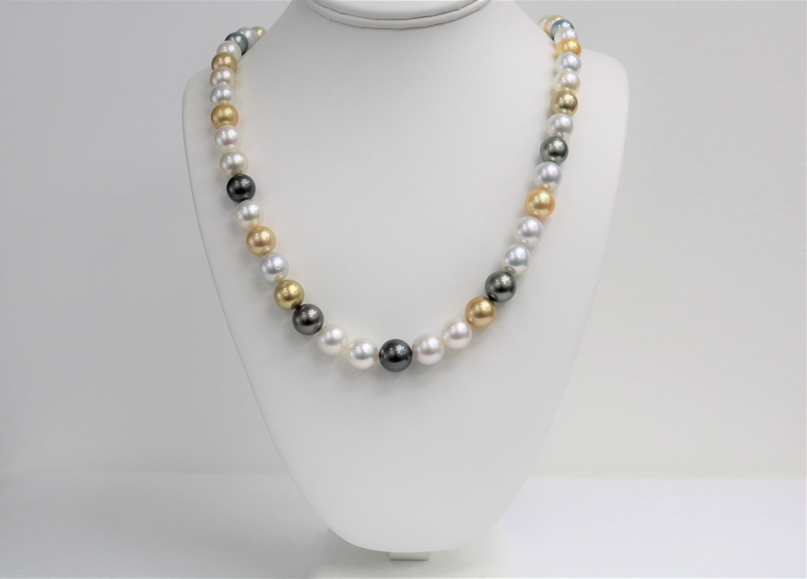 10-12mm Golden South Sea and Tahitian Multi Color Round Necklace with 14k Clasp: Title:10-12mm Golden South Sea and Tahitian Multi Color Round Necklace with 14k Clasp Description:AAA Quality Pearls, AAA Luster, Round/Near Round, 37 pearl pieces, 18 inches hand knotted with 14k YG