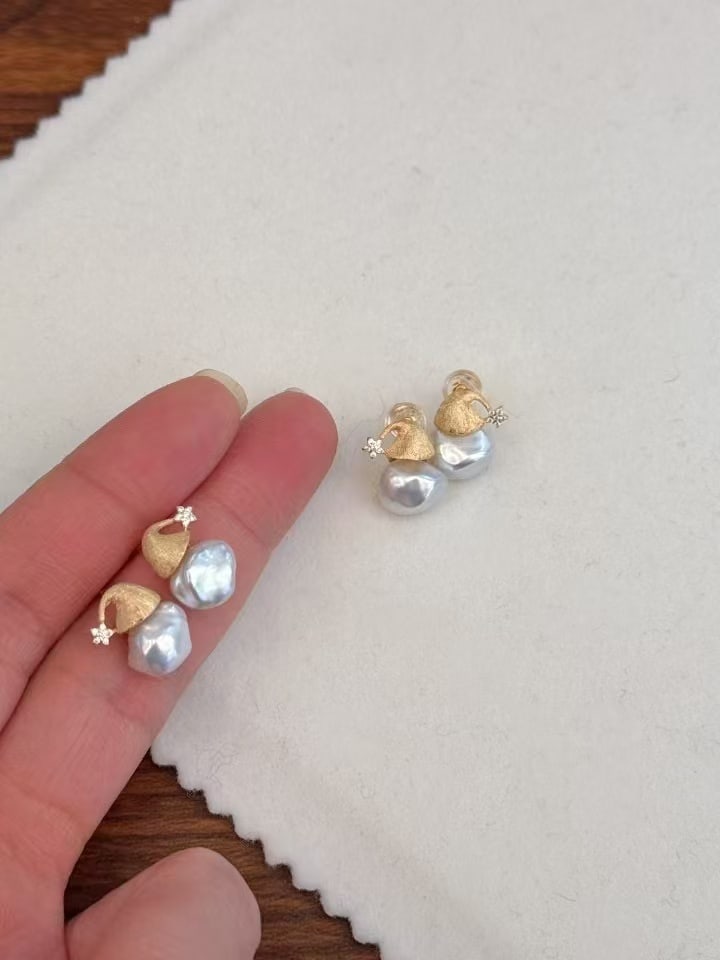 Sterling Silver Freshwater Pearl Earrings: Title: Sterling Silver Freshwater Pearl Earrings Description: These earrings are made of sterling silver and feature approximately 8mm freshwater pearls, showcasing exquisite luster and fullness. The