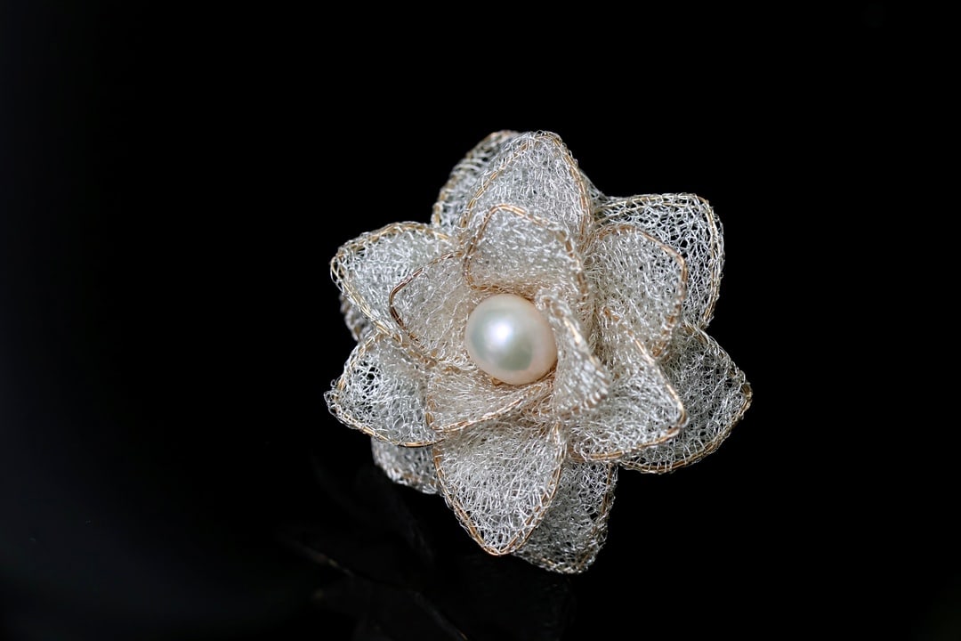 Natural Edison Pearl Ring: Title: Natural Edison Pearl Ring Description: This ring features a lace design and is set with a 10-11mm diameter natural Edison pearl. The pearl exudes a rich golden-white luster, has very few