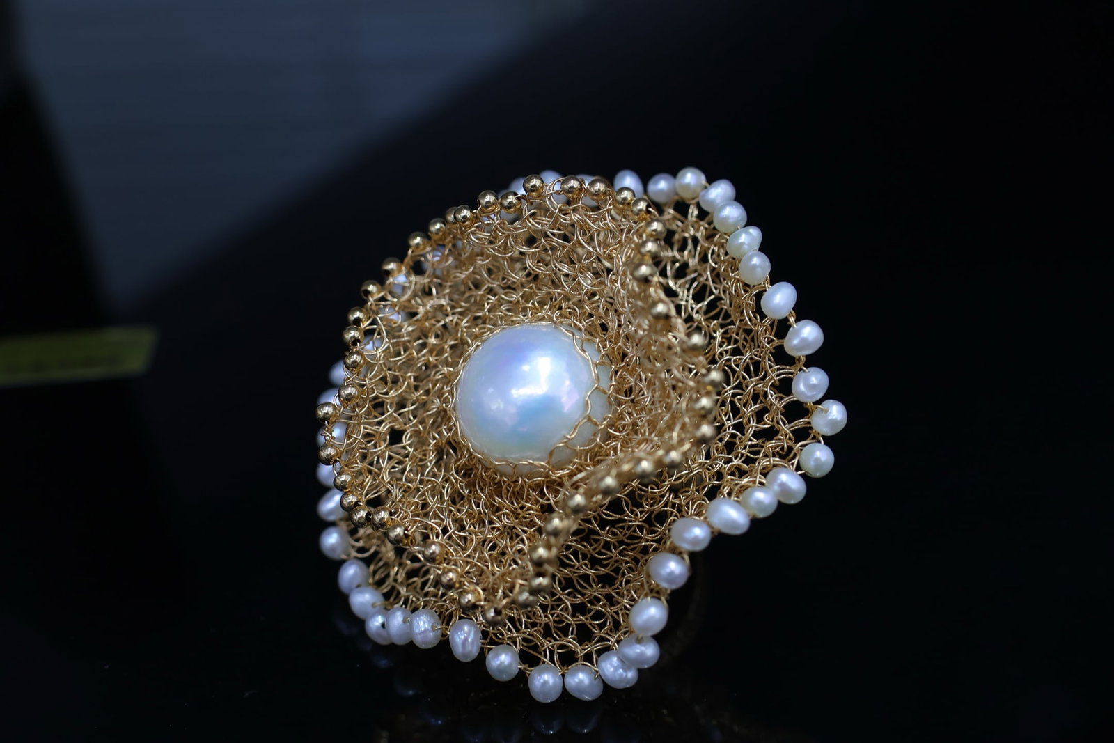 Natural Freshwater Pearl Ring: Title: Natural Freshwater Pearl Ring Description: This ring features natural freshwater pearls that exude a rich golden luster and a cool, white luster. Each pearl is carefully selected to ensure a la