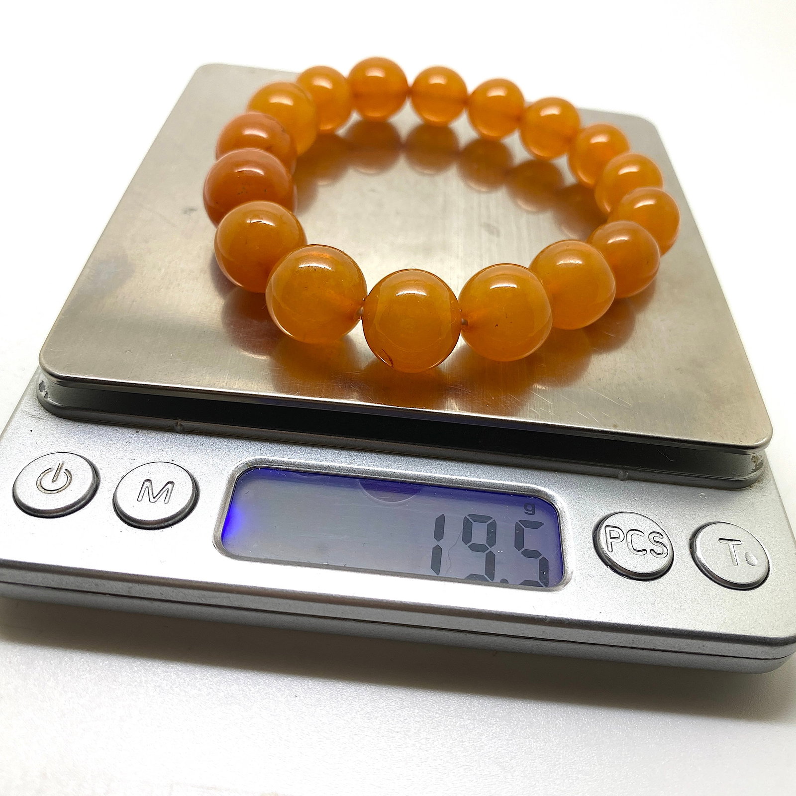 Beautiful Unique Vintage Amber Bracelet made from Round Amber beads: Title: Beautiful Unique Vintage Amber Bracelet made from Round Amber beads Metal: None Gemstone: Amber Weight: 19.5 g Size: Bead size: 14.0 mm Bead size: 0.551 inches Made of: (Reconstituted Amber or 