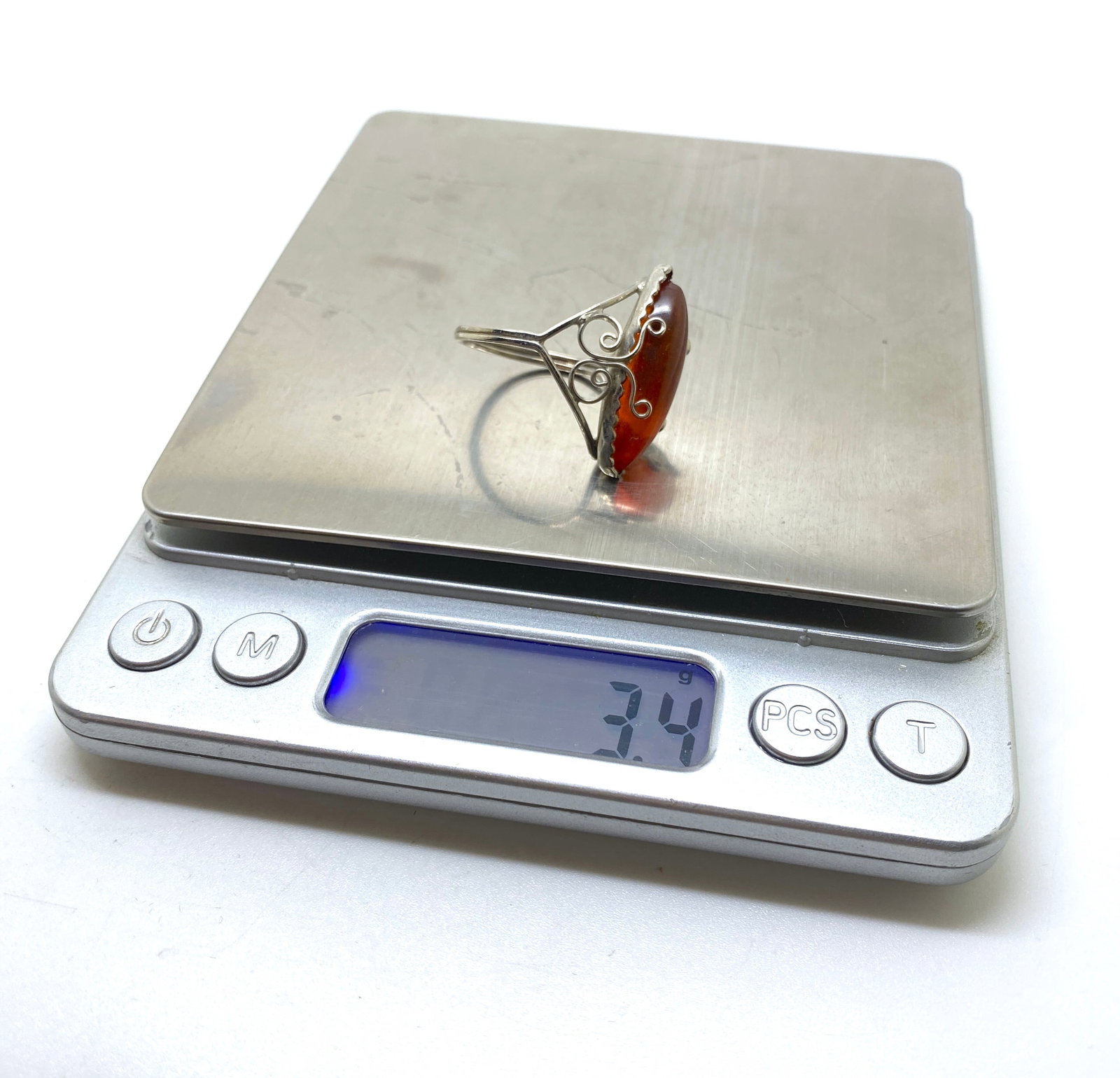 Fascinating Unique Vintage Amber Ring: Title: Fascinating Unique Vintage Amber Ring Metal: None Gemstone: Amber Weight: 3.4 g Size: Inner diameter: 19.0 mm Size: 26.0 x 22.0 x 29.0 mm Size: 1.024 x 0.866 x 1.142 inches Inner diameter: 0.74