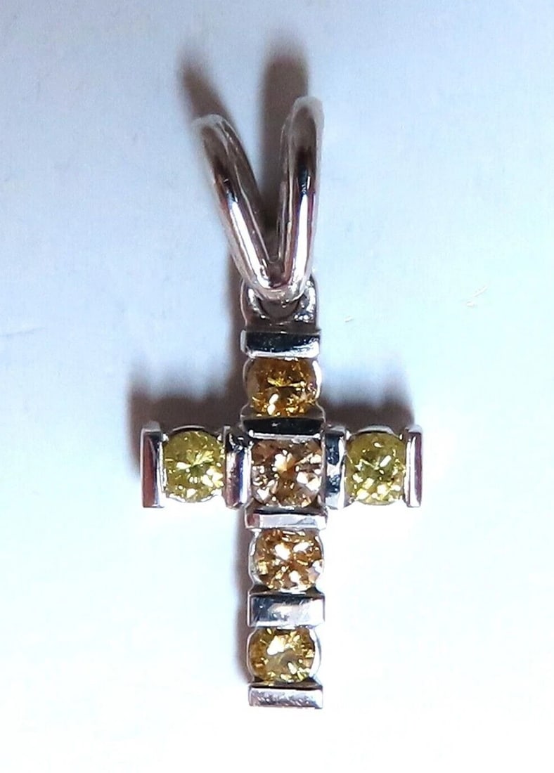 .60ct Natural Fancy Yellow Diamonds Cross Pendant 14 Karat**: Title: .60ct Natural Fancy Yellow Diamonds Cross Pendant 14 Karat** Description: Fancy Yellows Cross Pendant .60ct natural diamonds cross Full cut brilliant Vs-2 Clarity. 14kt. white gold. 1.9 grams. 