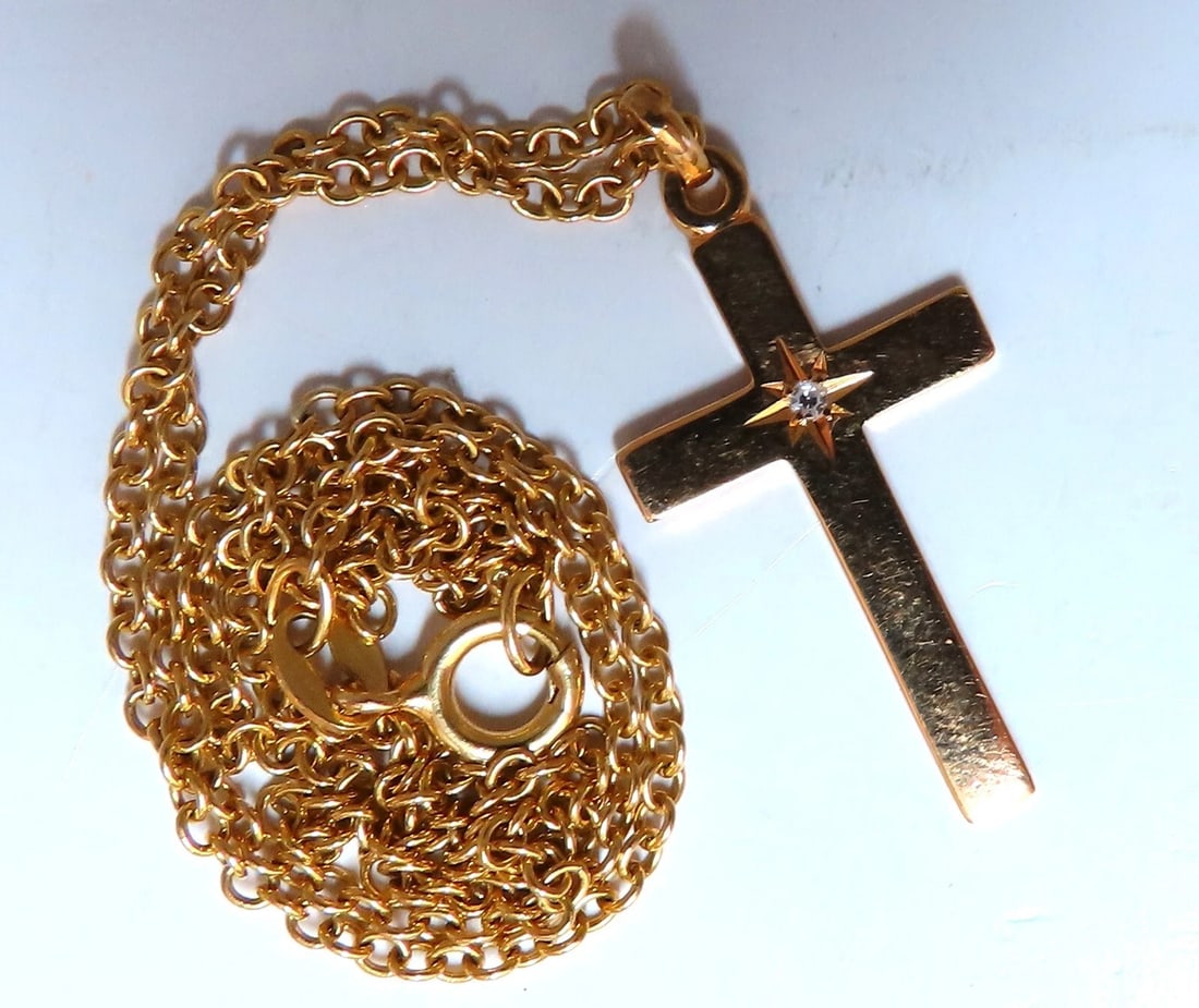 14kt gold cross diamond pendant 14kt 14 inch**: Title: 14kt gold cross diamond pendant 14kt 14 inch** Description: Midsize Gold cross pendant .05ct diamond H-color Vs-2 clarity 14kt. Yellow gold. 4.8grams. cross total measurement: 23 x 14mm