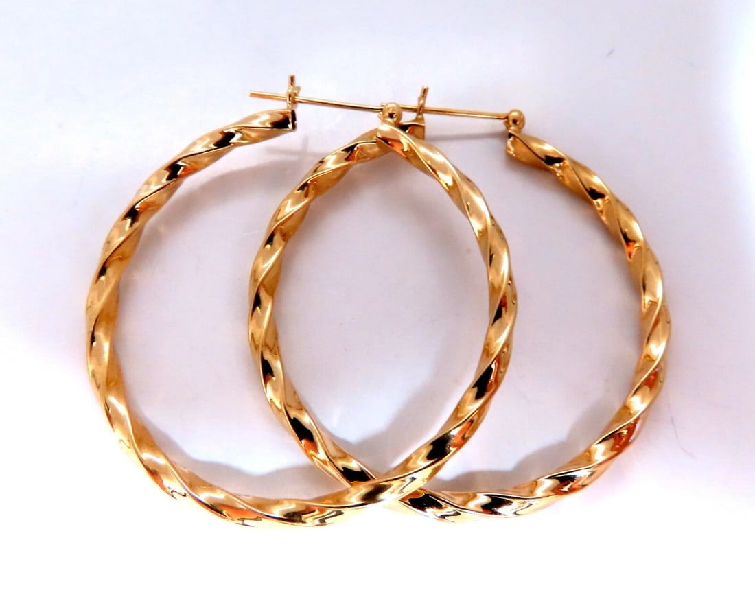 14Kt Gold Hoop Candycane Twist**: Title: 14Kt Gold Hoop Candycane Twist** Description: Gold Hoop Earrings Measurements of Earrings: 43mm diameter. 3.2mm wide. 5 grams / 14kt. yellow gold Earrings are gorgeous made ....*..*. Reserve: $