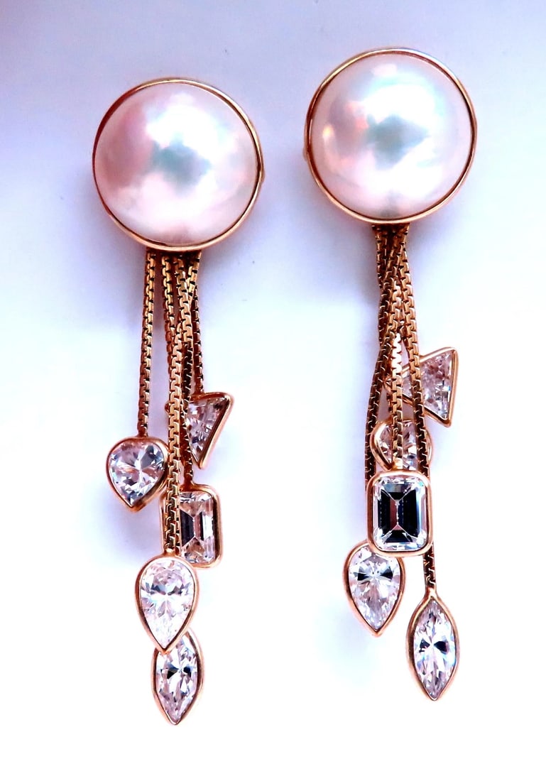 18mm Mabe Pearl Dangle CZ 14kt gold earrings Cosmopolitan Edit 12385**: Title: 18mm Mabe Pearl Dangle CZ 14kt gold earrings Cosmopolitan Edit 12385** Description: 18mm Mabe Pearl Dangle CZ 14kt gold earrings Cosmopolitan Edit 12385 $700.00 PRODUCT DESCRIPTION 18mm Mabe