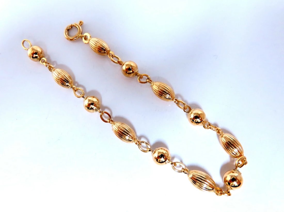 Melon & Bead Link Chain Bracelet 7inch 14kt gold**: Title: Melon & Bead Link Chain Bracelet 7inch 14kt gold** Description: Melon & Ball Bead Chain Link Bracelet Durable, Well Made 14kt. yellow gold 6.3 Grams. 5mm wide 7 inch long wide caliber