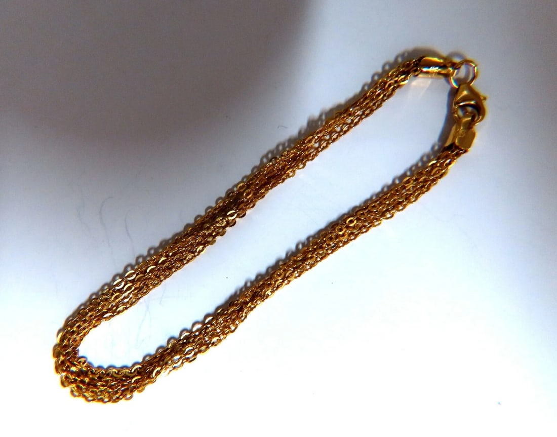 14kt gold 5 combined multichain link bracelet**: Title: 14kt gold 5 combined multichain link bracelet** Description: Classic 5 chain link bracelet 1mm caliber each chain 14 karat yellow gold 2.8 grams Chain measure 7 inch Secure lock ......*..*.