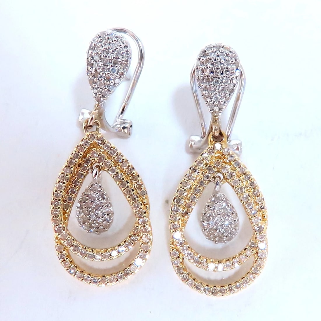 1.20ct Pear Shape Halo Dangle Earrings 14kt**: Title: 1.20ct Pear Shape Halo Dangle Earrings 14kt** Description: Dangle Pear Shaped Halo Earrings 1.20cts of natural round diamonds: H-color, I2 clarity. 14kt. white / yellow gold 4.7 grams. Earrings