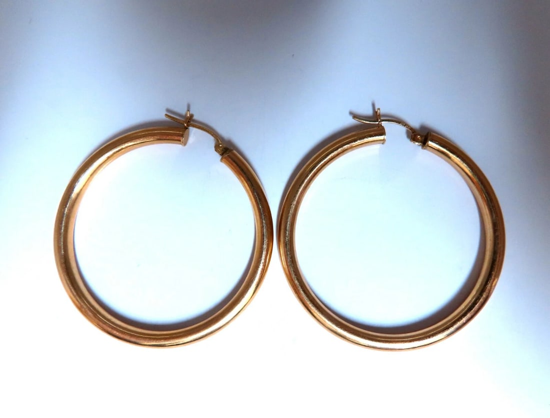 14Kt Gold Hoop Earrings Tubular Plain 1.85 inch diameter**: Title: 14Kt Gold Hoop Earrings Tubular Plain 1.85 inch diameter** Description: Gold Hoop Earrings Measurements of Earrings: 47mm diameter / 1.85 inch 4mm wide. 5.8 grams / 14kt. yellow gold Earrings a