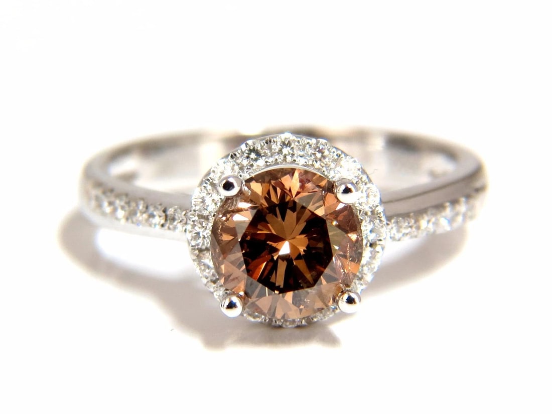 1.78ct natural fancy vivid orange brown diamond ring 18kt**: Title: 1.78ct natural fancy vivid orange brown diamond ring 18kt** Description: Raised Solitaire Round. 1.28ct. Natural round diamond ring Fancy vivid orange brown color Si-1 clarity Very good Cut / F