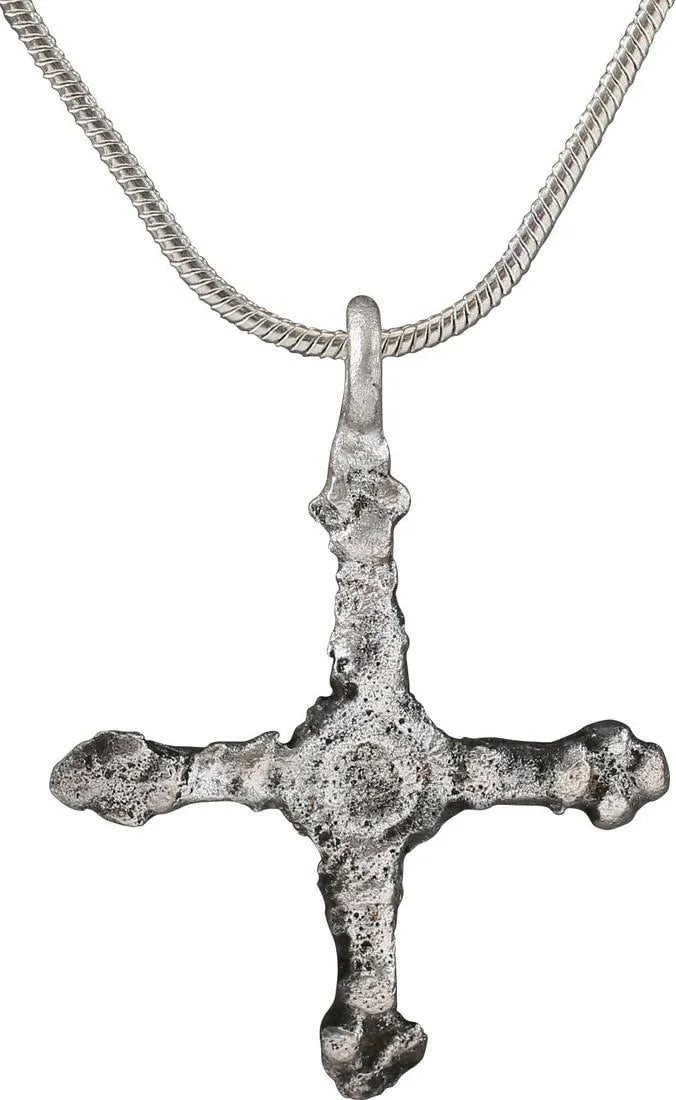 FINE EARLY CHRISTIAN CONVERT'S CROSS NECKLACE, 9th-11th C.AD: Silvered bronze. Just under 1 1/8" height, of elegant form. Crossbeam centered with concentric circles at the intersection. Each beam with a triple circle terminal which later evolved into the "