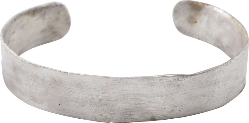 ROMAN BRACELET C.1ST-2ND CENTURY AD: Gilt bronze, 2.60" inside dimension. Just over ½" width (0.51" �) with spatulate terminals. Suitable for wear by a woman or man. Surface with light tool finish as made. Professionally