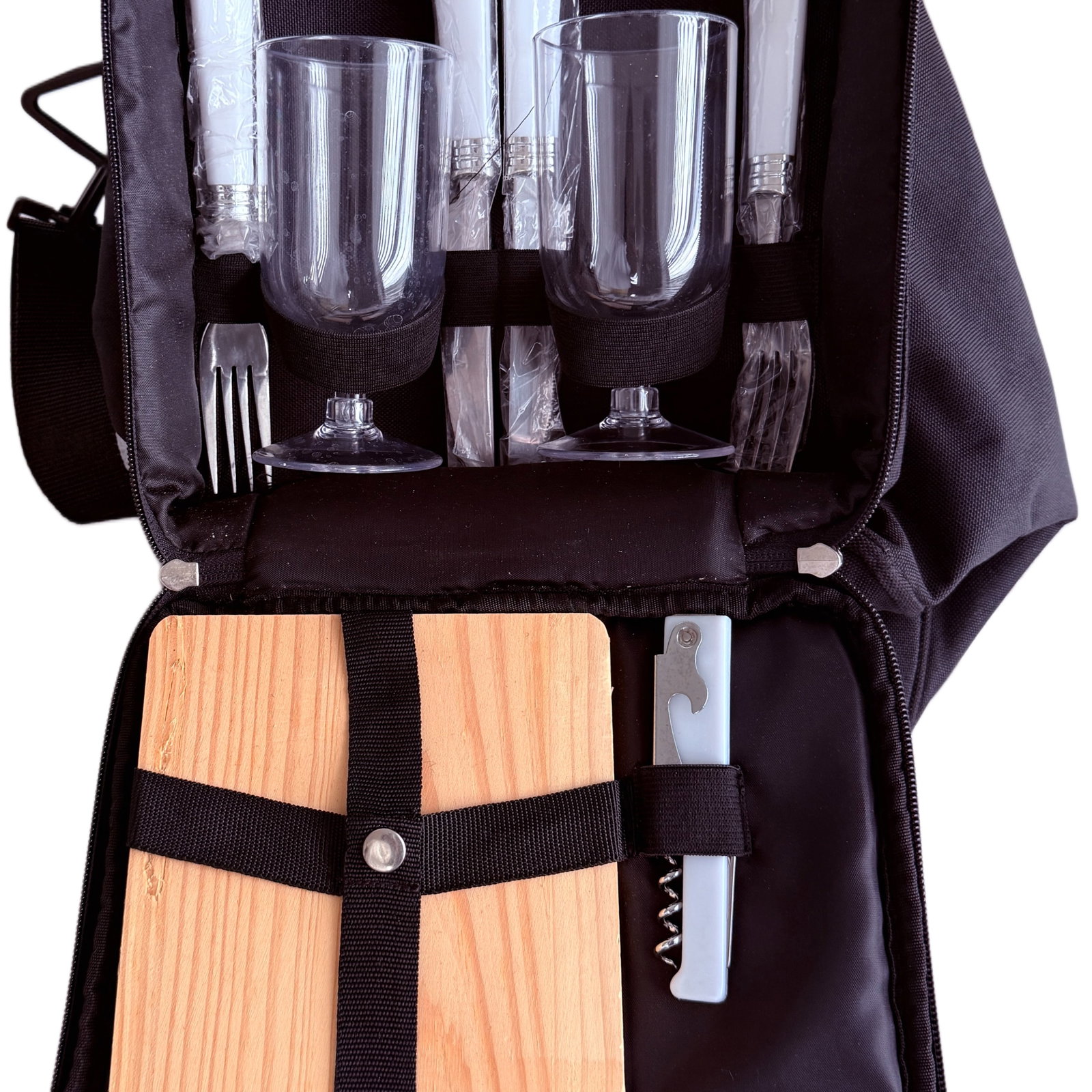 Portable Insulated Picnic Backpack with Place Settings and Cutting Board: A modern and practical portable insulated picnic backpack, likely dating from the 21st century. The backpack is constructed from durable black nylon or similar synthetic fabric, featuring multiple