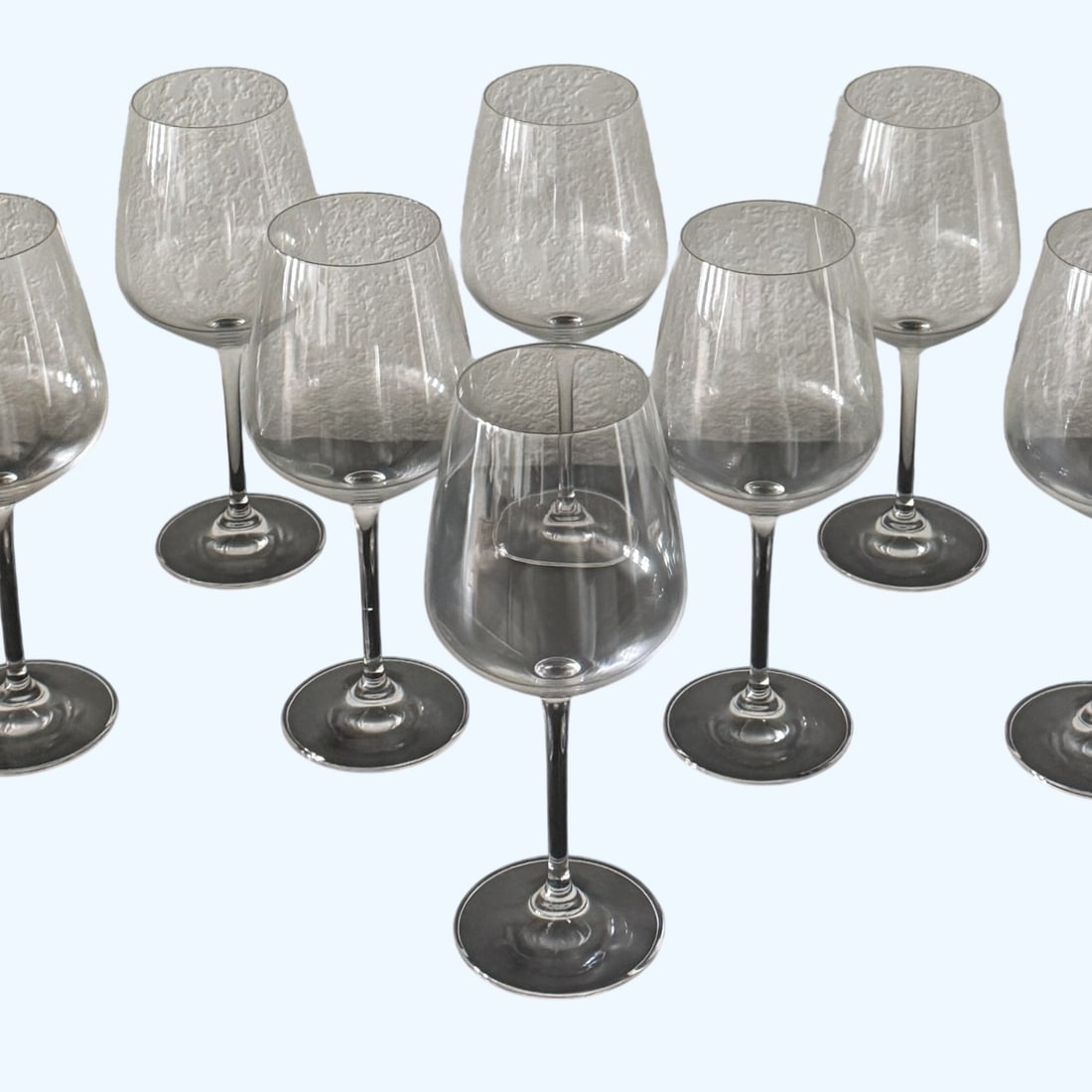Set of Ten Contemporary Clear Blown Glass Wine Goblets: This lot features a set of ten contemporary clear blown glass wine goblets, 18 oz. Dimensions: Height - 9" Width - 3.5" Depth - 3.5" Weight - 5 lbs Your purchase is protected: In the rare event that
