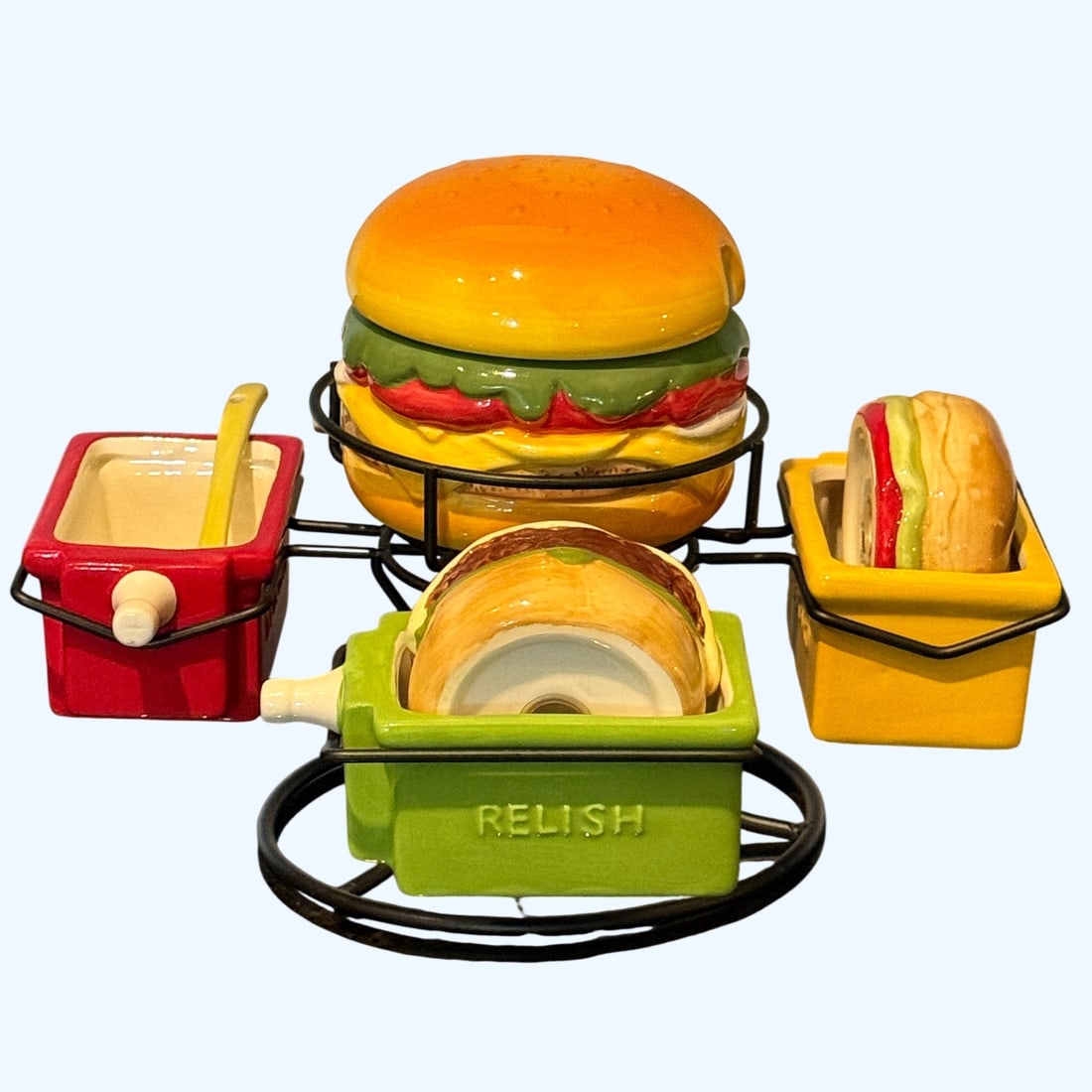 Pier 1 Imports "Hamburger" Condiment Set with Salt and Pepper Shakers: A whimsical and highly collectible ceramic condiment set by Pier 1 Imports, designed in the late 20th to early 21st century. This set features a charming hamburger-shaped lidded crock for a main condi