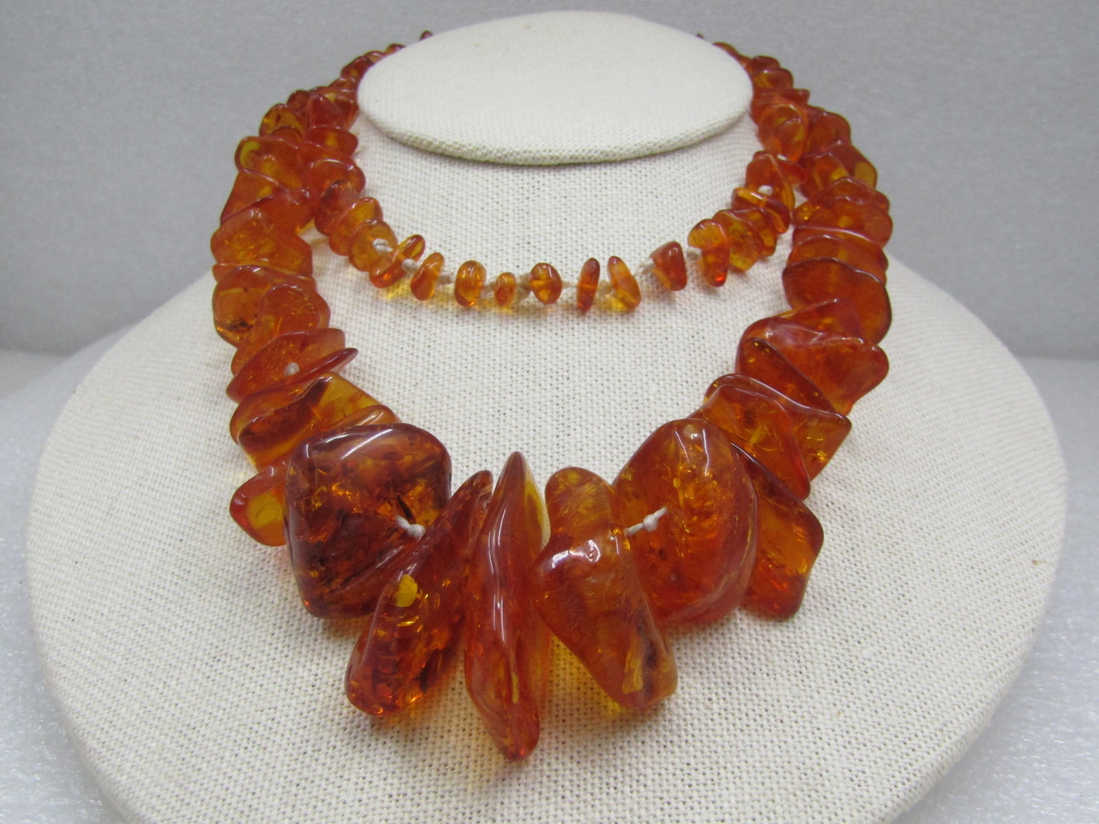 Vintage Graduated Honey Amber Necklace, Knotted, 28", Baltic: Vintage Graduated Honey Amber Necklace, Knotted, 28", Baltic, 1980's. This came from the estate of an ambr collector. It has honey amber polished nuggets from 6mm to 38mm long - the longest at the fro