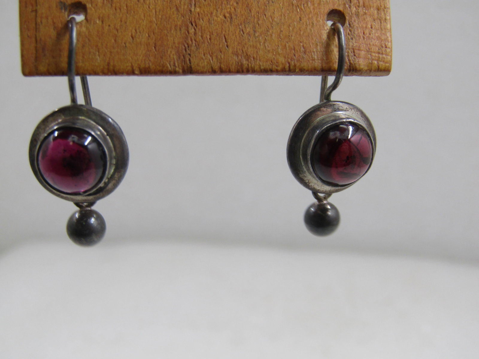 Vintage Silpada Sterling Amethyst Drop Earrings, Pierced, Retired: Vintage Silpada Sterling Amethyst Drop Earrings, Pierced, Retired. Bezel-set 8.5mm round amethysts in a stud with pierced hook attached and a single 4.5mm round silver bead that dangales from the
