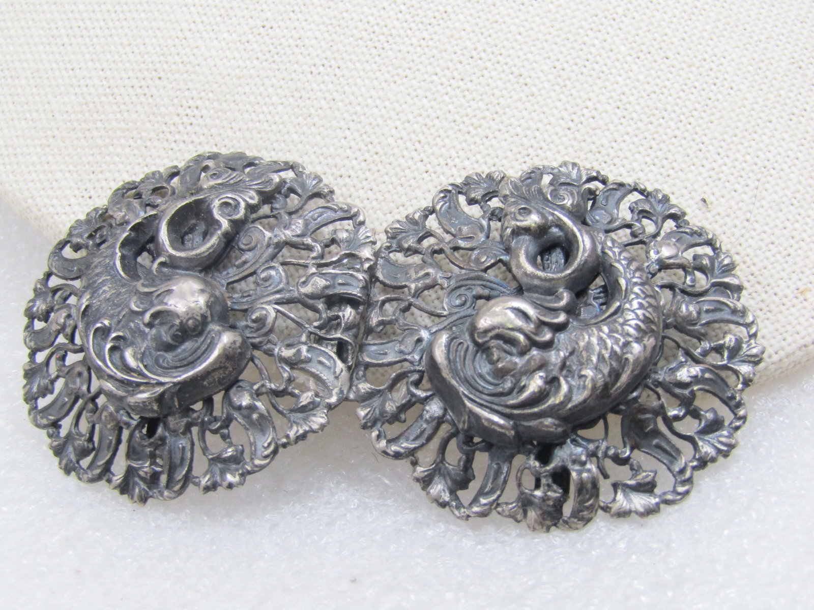 Art Nouveau Mythical Mermaid/Mermen Buckle, Early 1900's, 3", 1895-1910: Art Nouveau Mythical Mermaid/Mermen Buckle, late 1800's to early 1900's, 3". This is made up of two round sections of the belt, one with the hook and one with the loop to hook the clasp.
